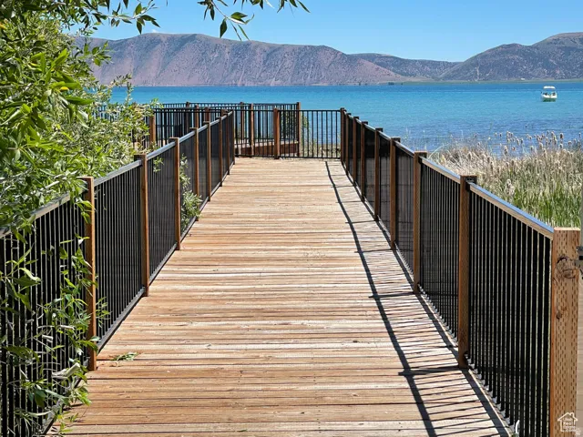 View of property's community featuring a water and mountain view