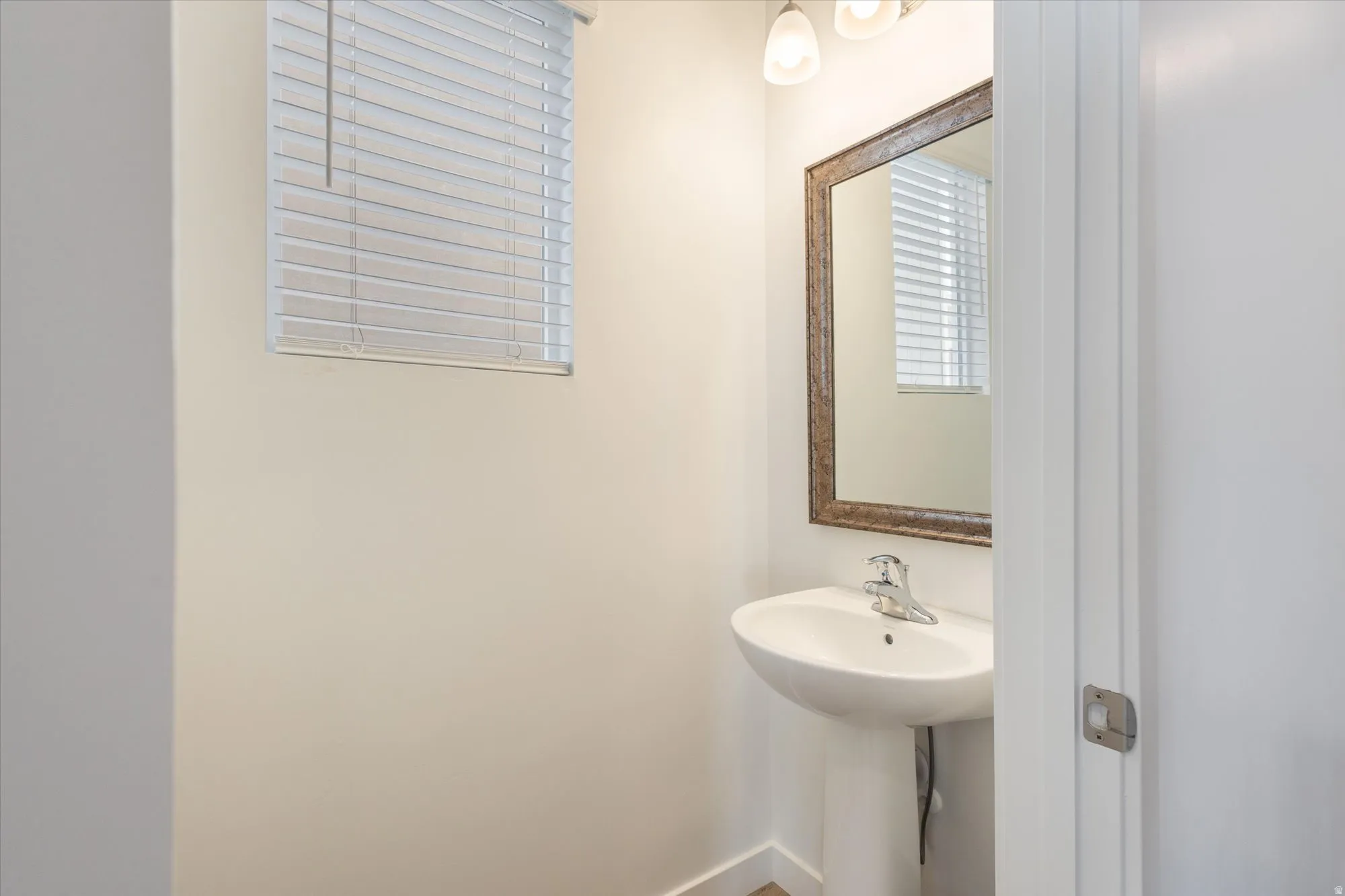 Bathroom featuring baseboards