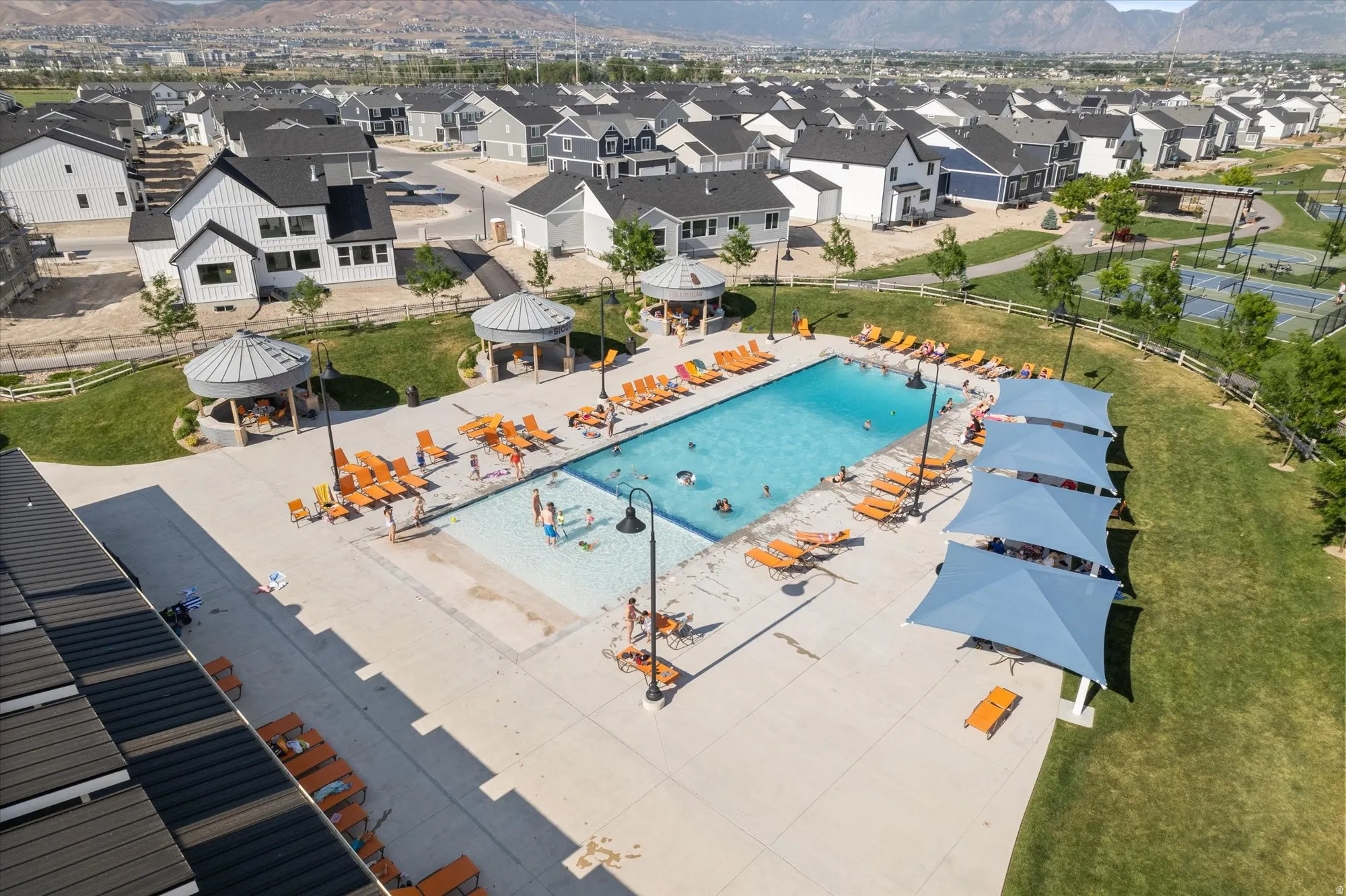 Community pool featuring a mountain view, a patio, and a residential view