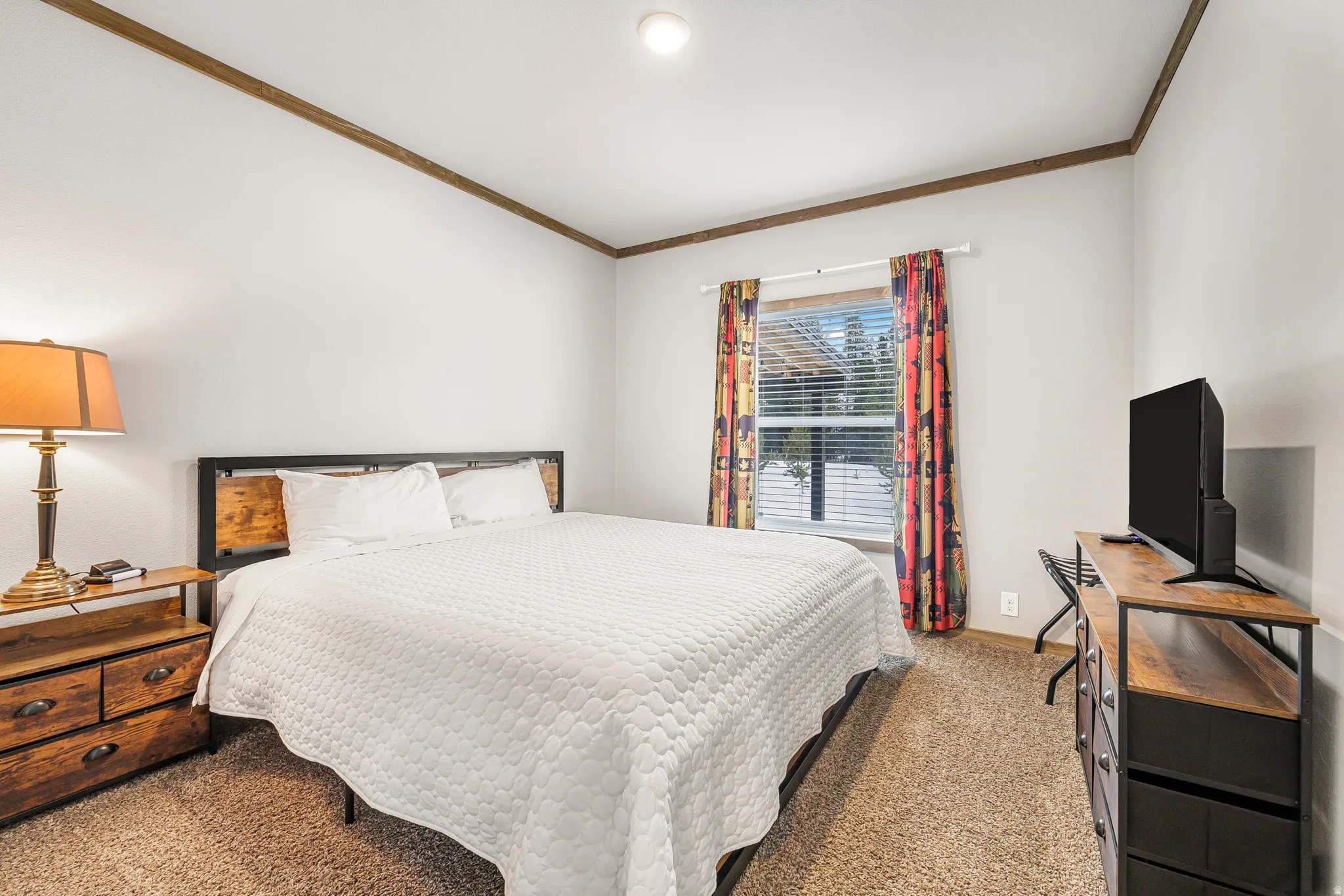 Bedroom with carpet flooring and ornamental molding