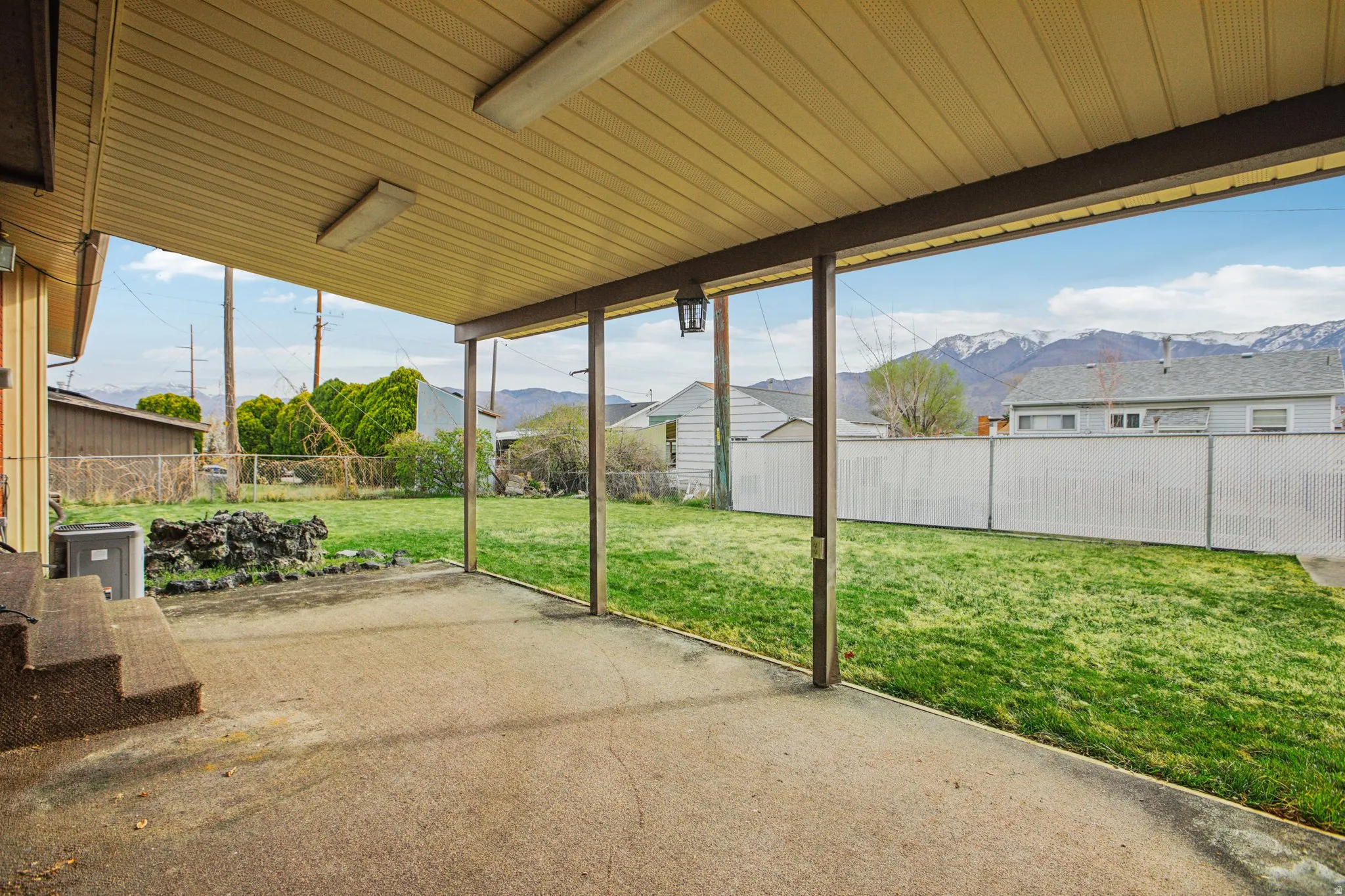 Unfurnished sunroom with a mountain view