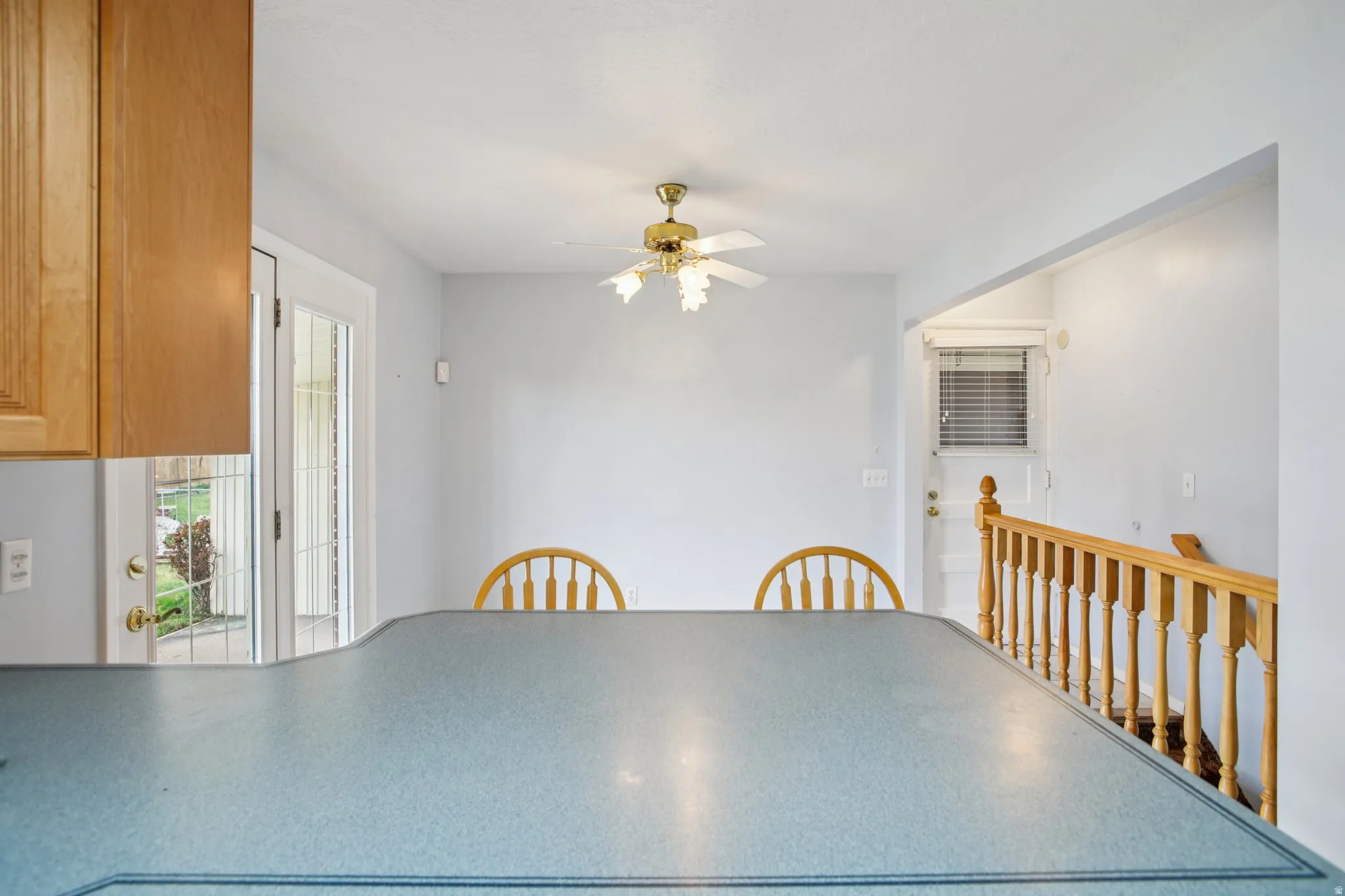 Unfurnished dining area with ceiling fan