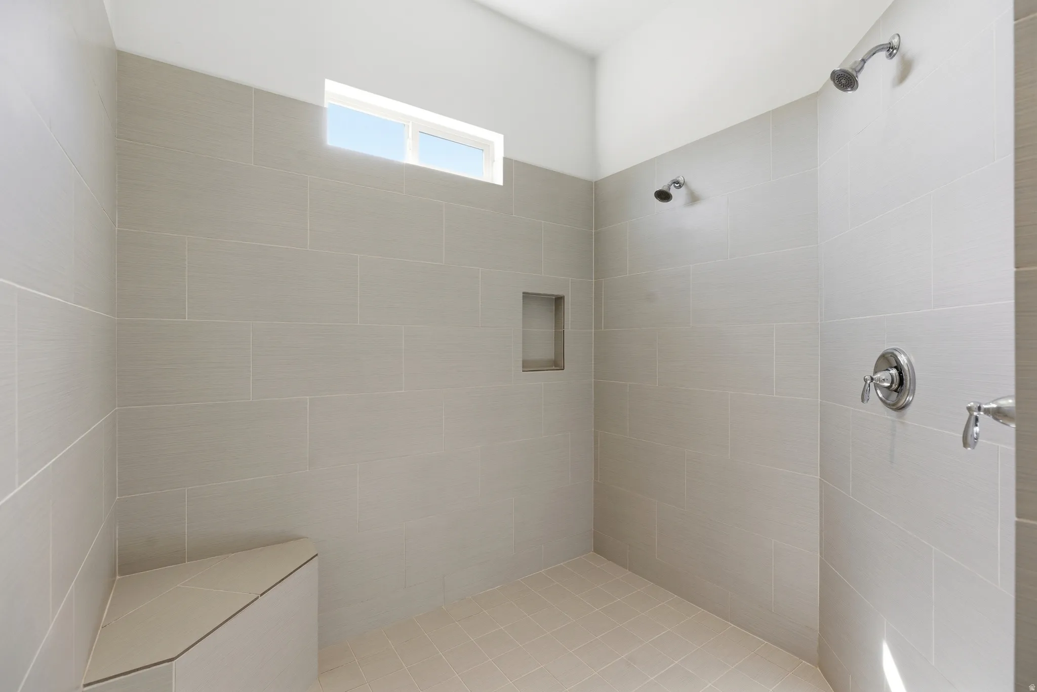 Full bathroom with tiled shower