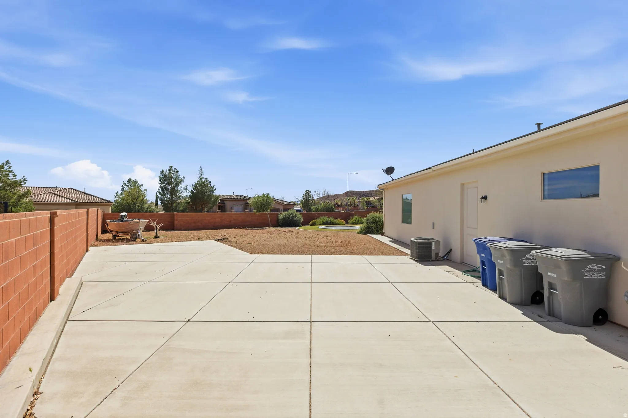 View of fenced backyard