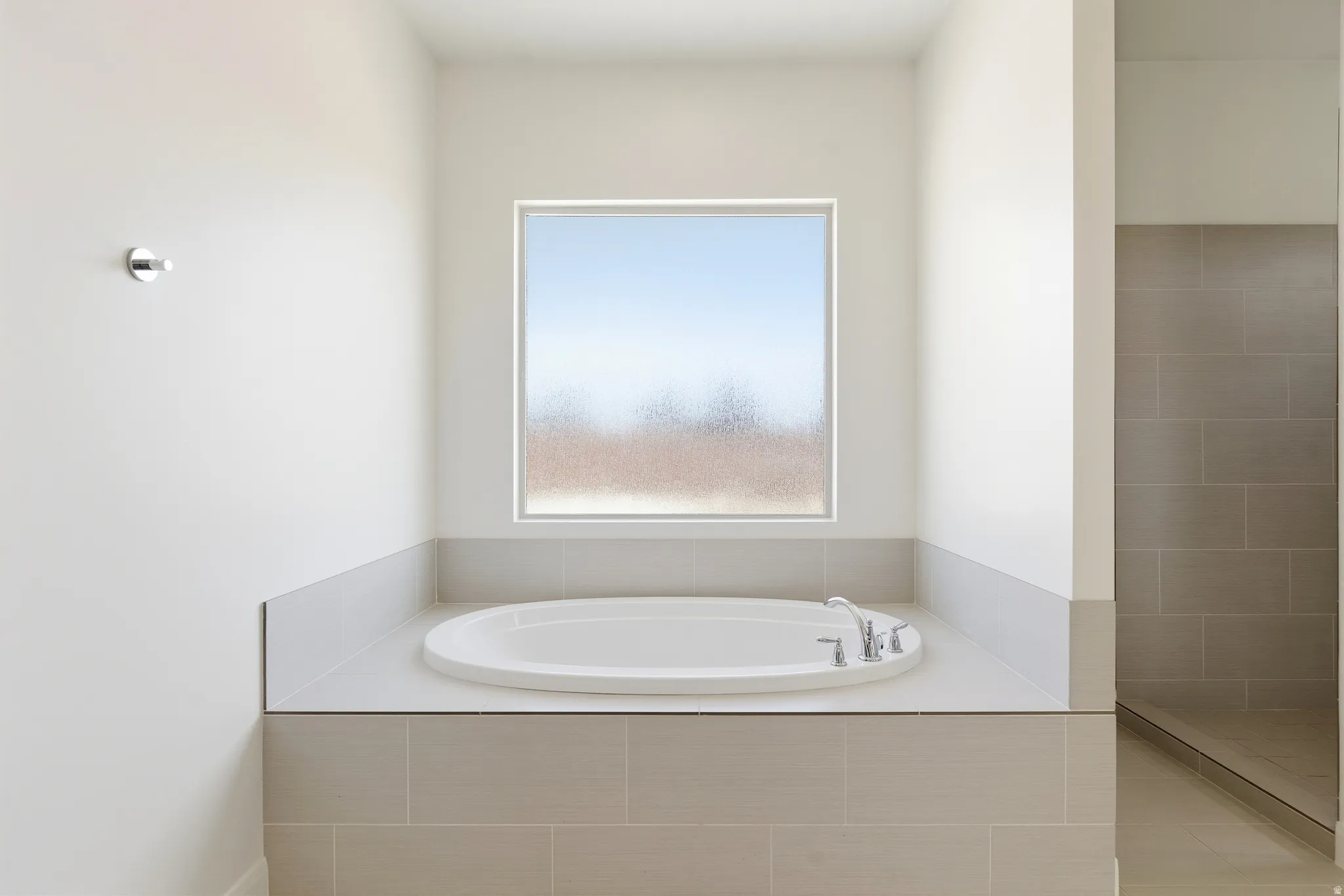 Full bath with a garden tub and tiled shower