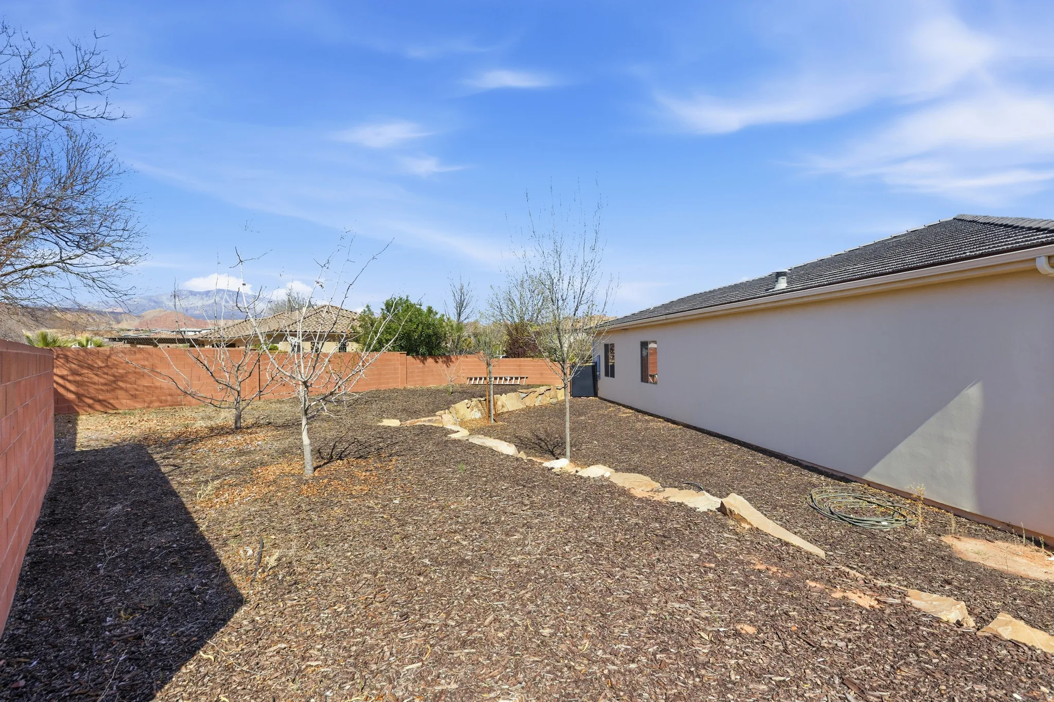 View of fenced backyard