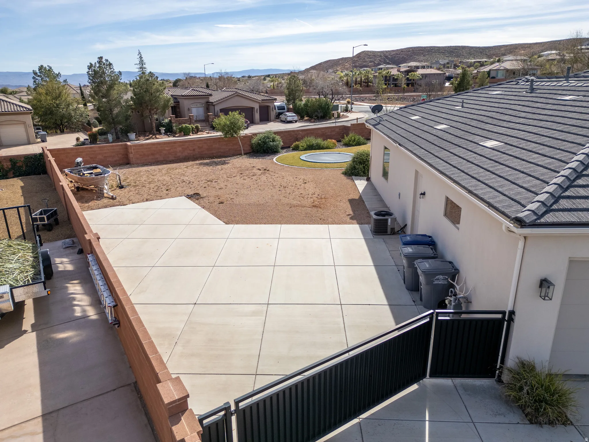 Aerial perspective of suburban area featuring a mountain backdrop