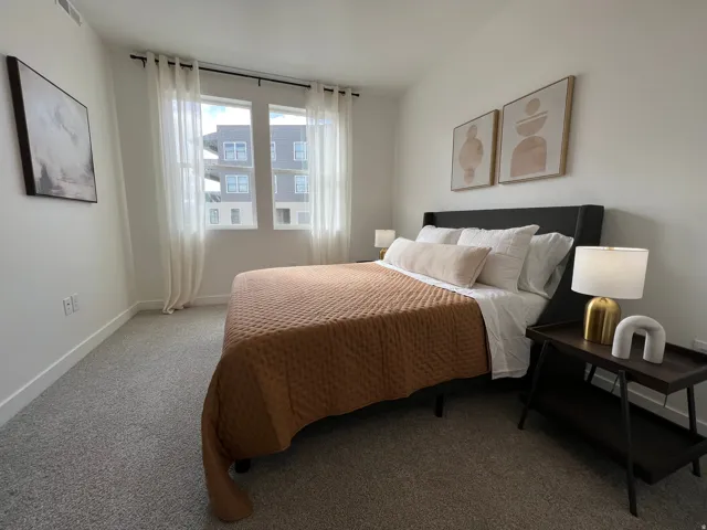 Carpeted bedroom with baseboards