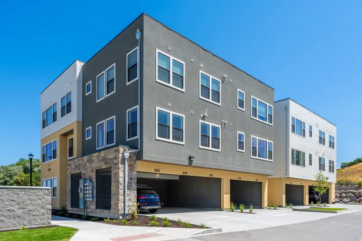 View of building exterior featuring a garage