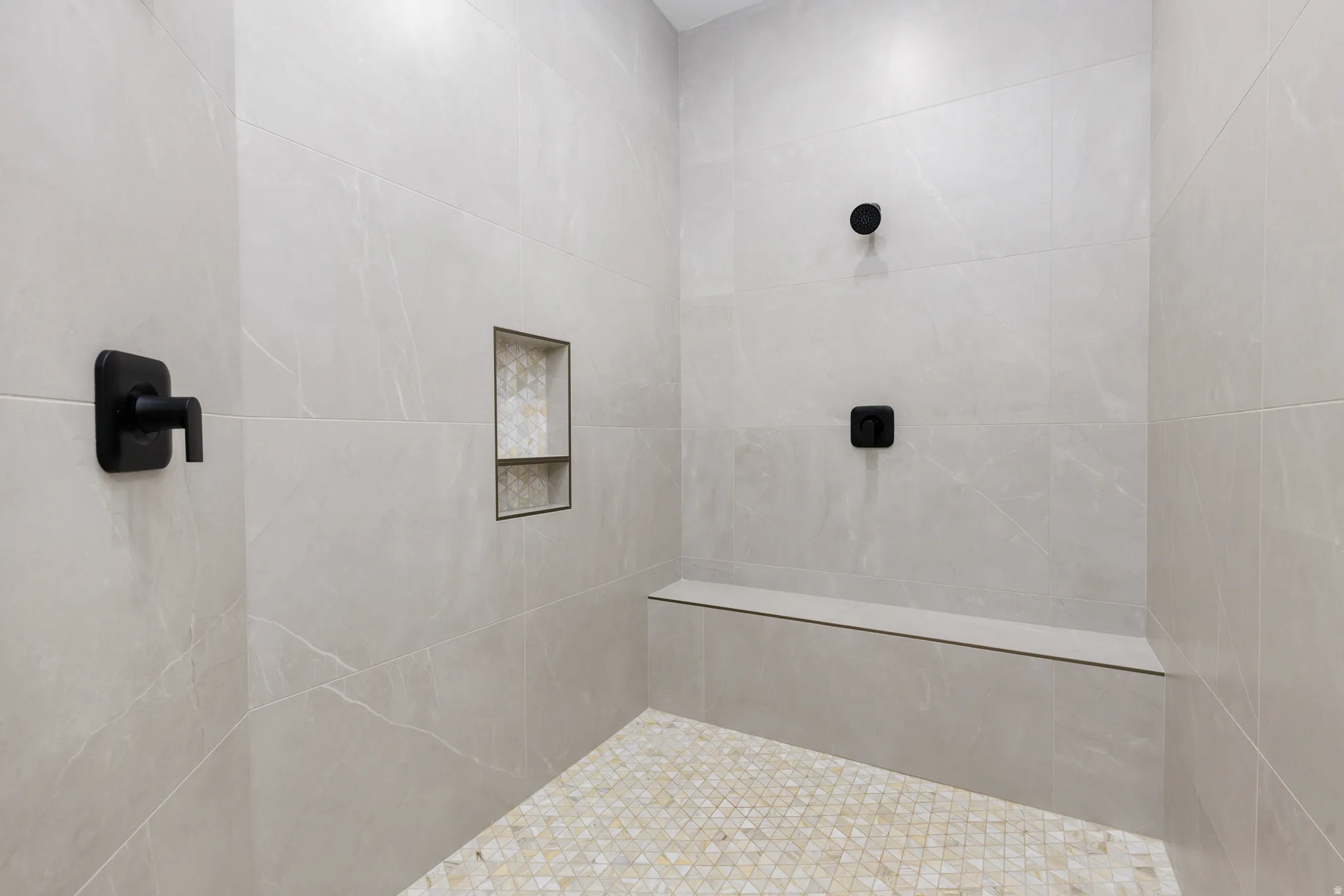 Bathroom featuring a tile shower