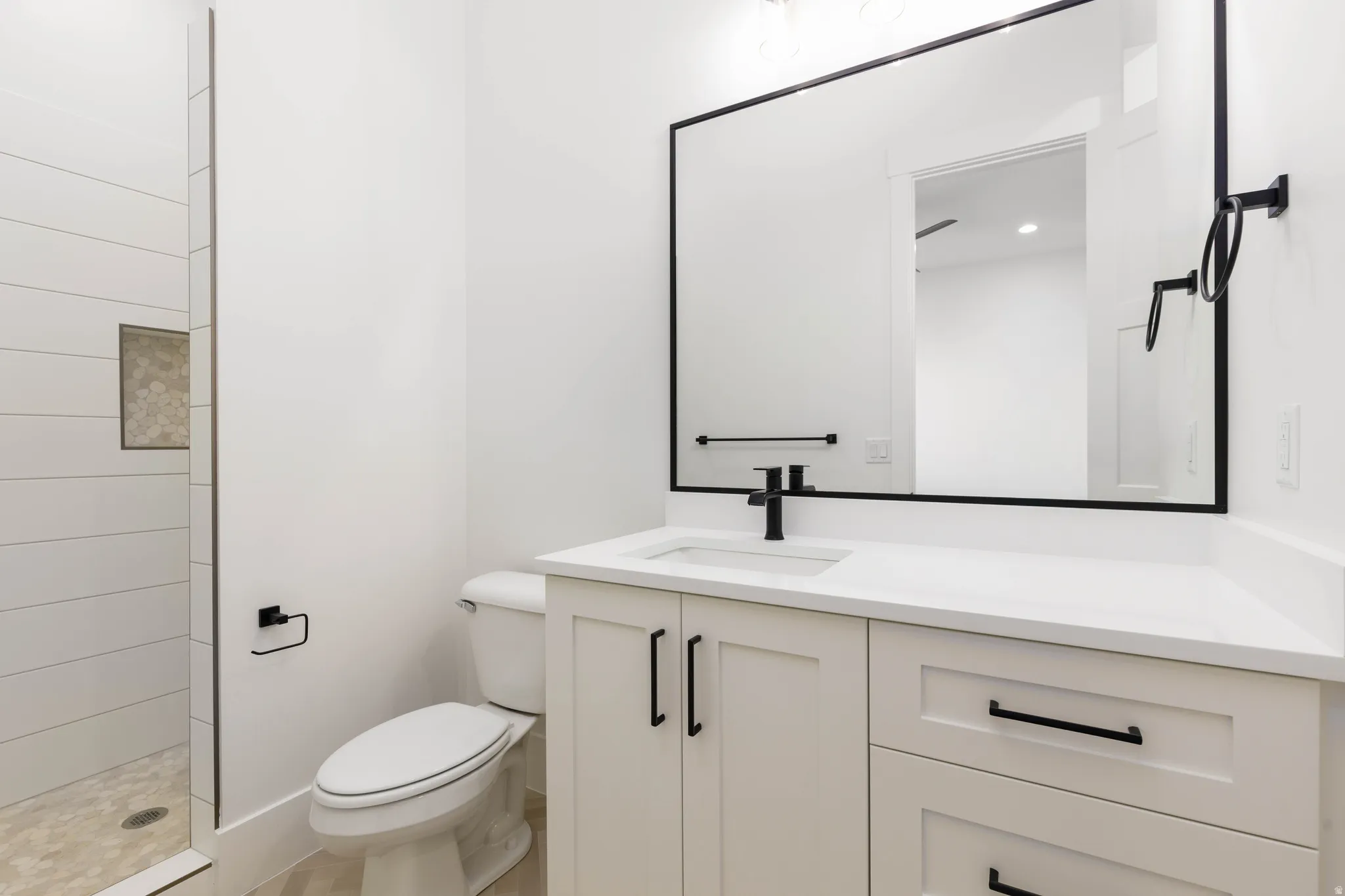 Full bathroom with vanity and tiled shower