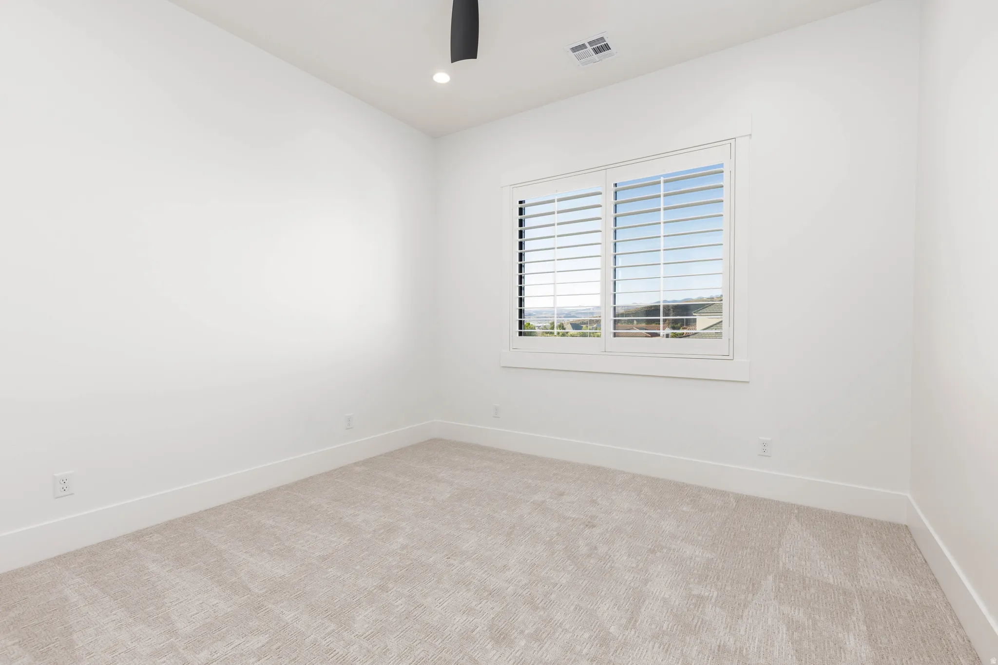 Unfurnished room featuring light colored carpet, recessed lighting, and ceiling fan