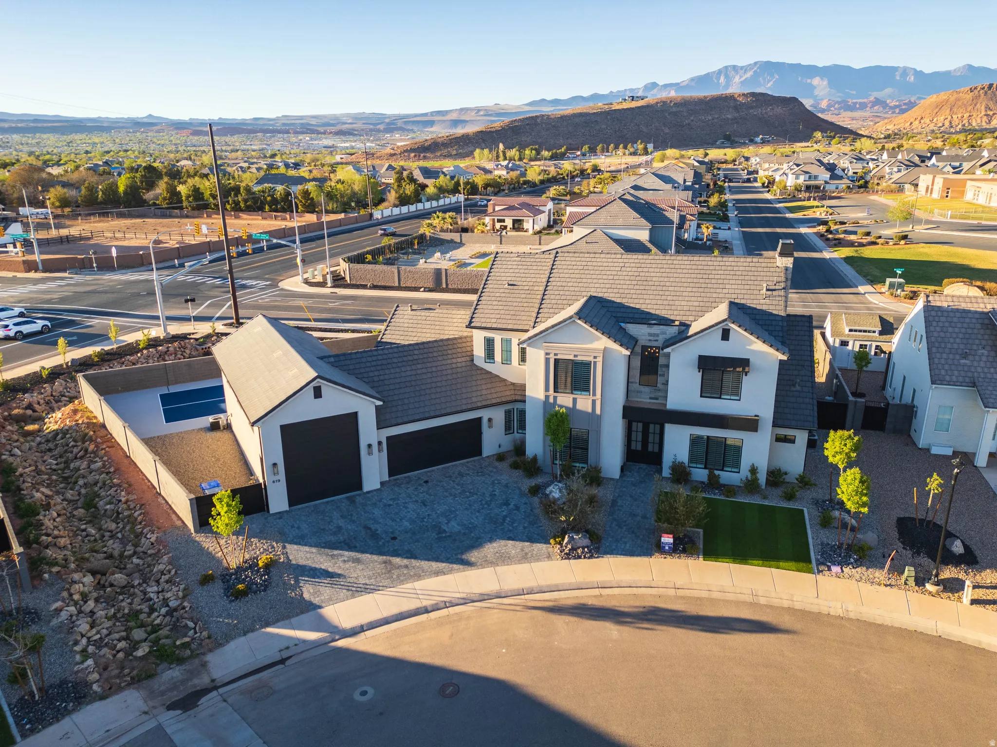 Aerial view of residential area featuring a mountain backdrop