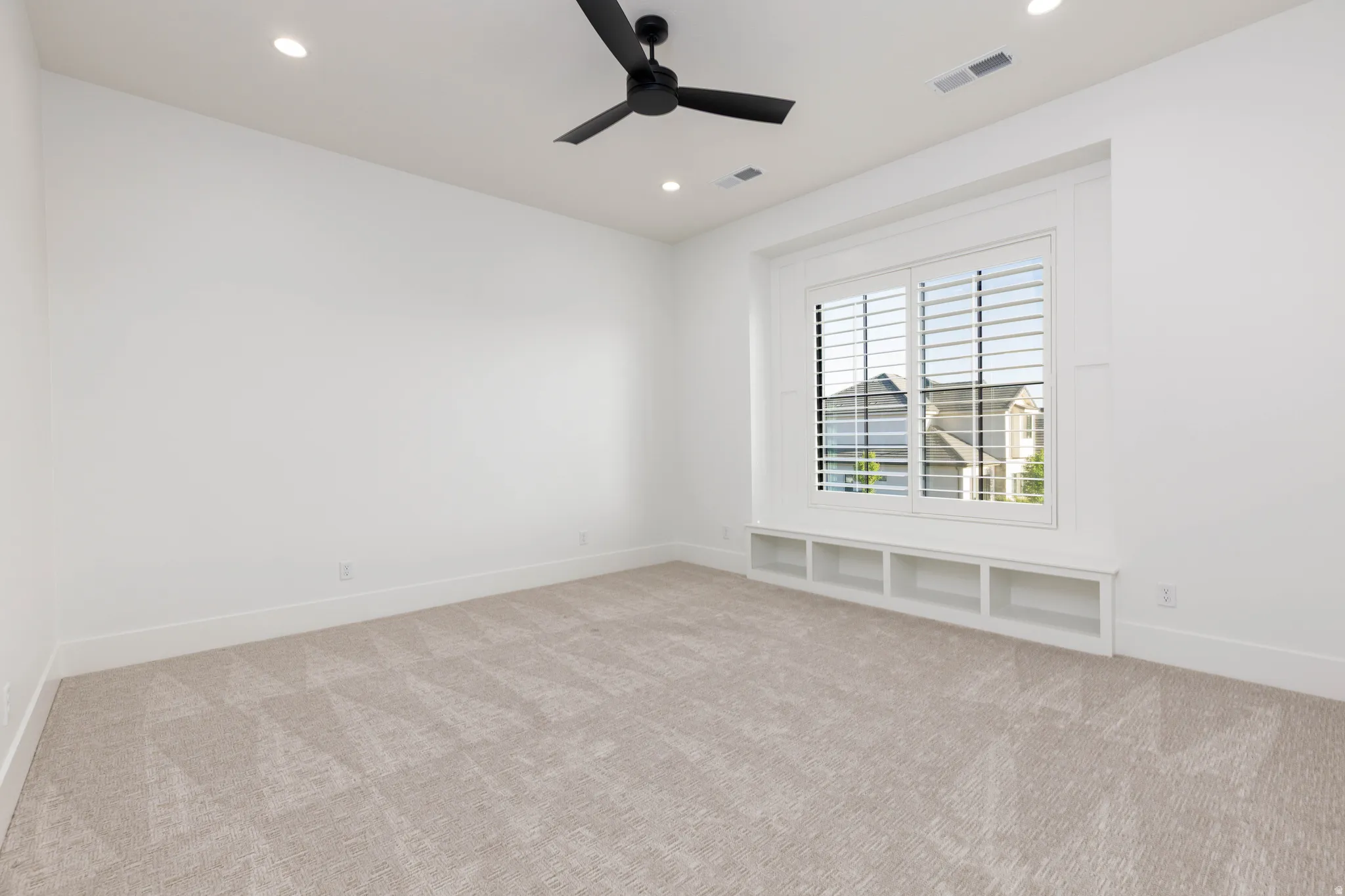 Unfurnished room featuring recessed lighting, light carpet, and ceiling fan