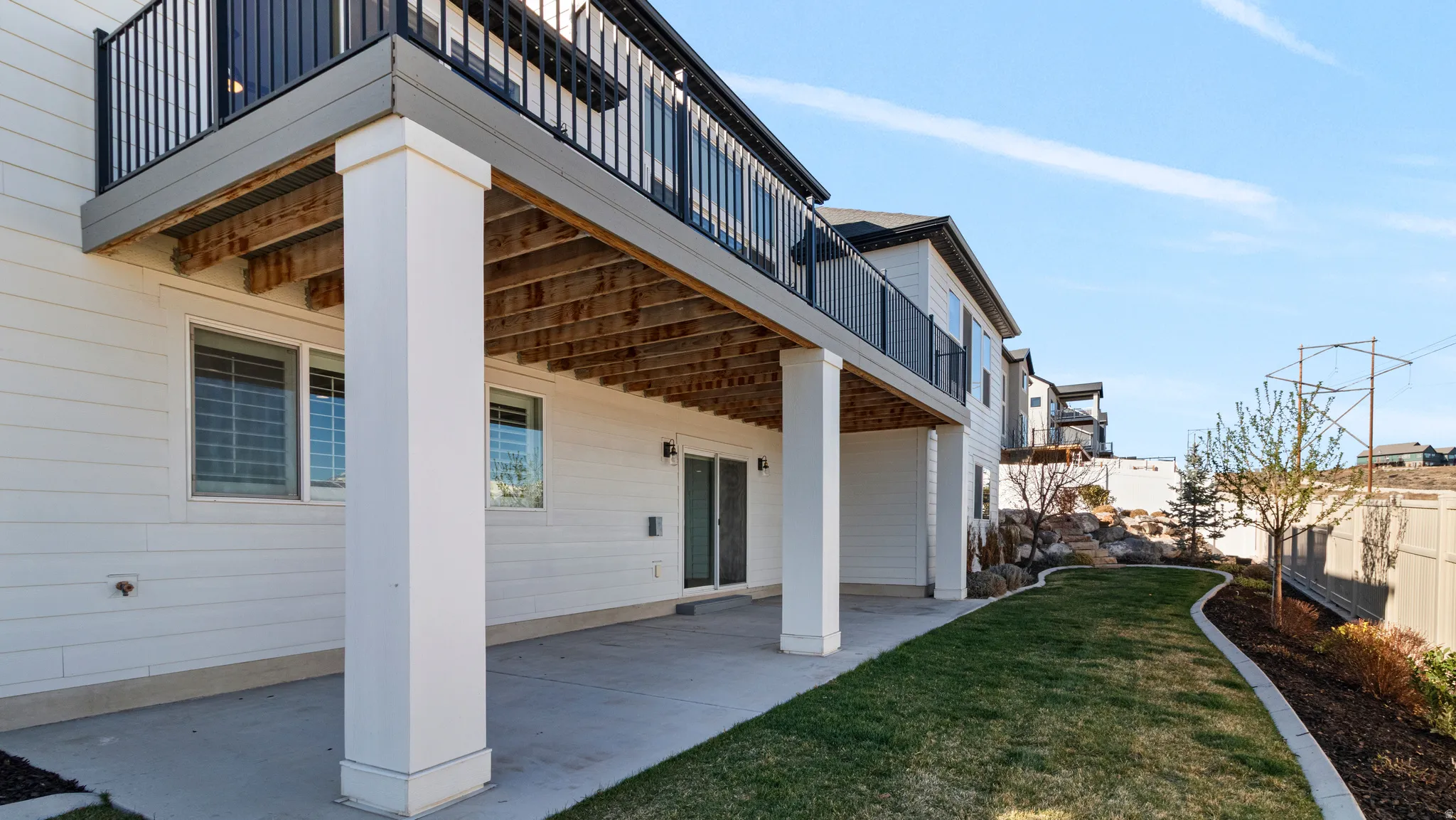 View of exterior entry featuring a patio