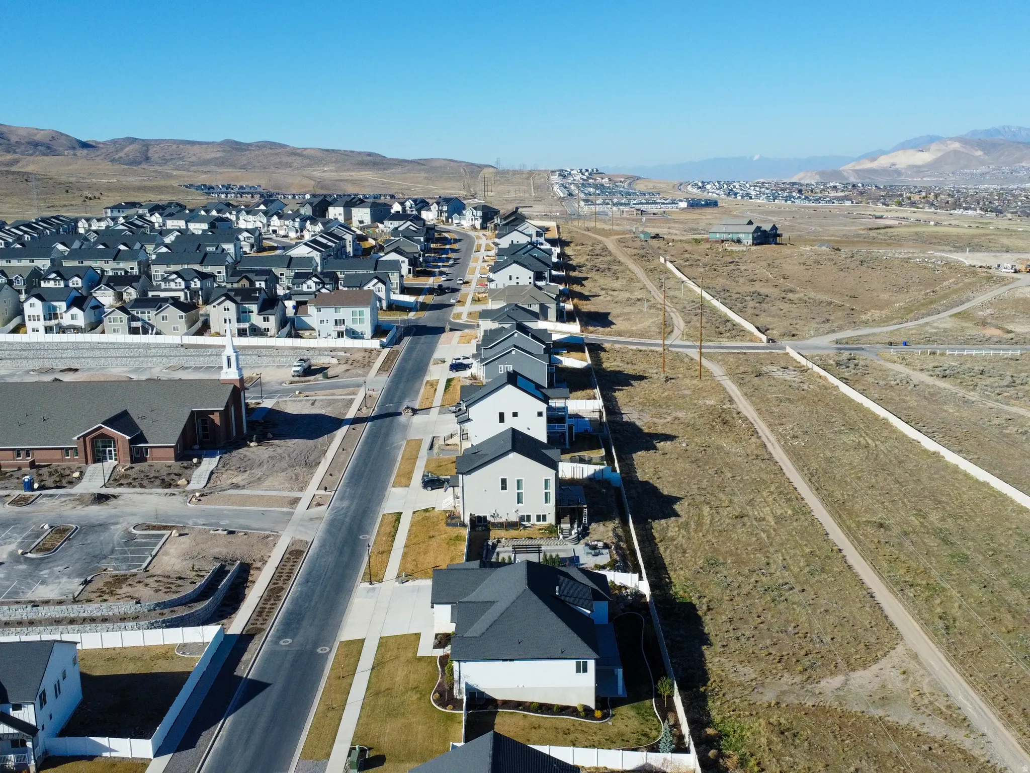 Aerial view of residential area with a mountainous background