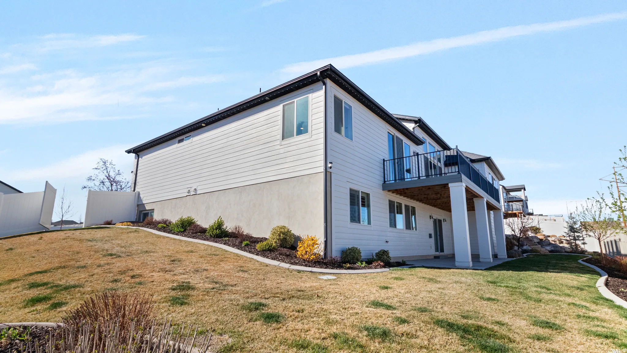 View of side of property with a patio area
