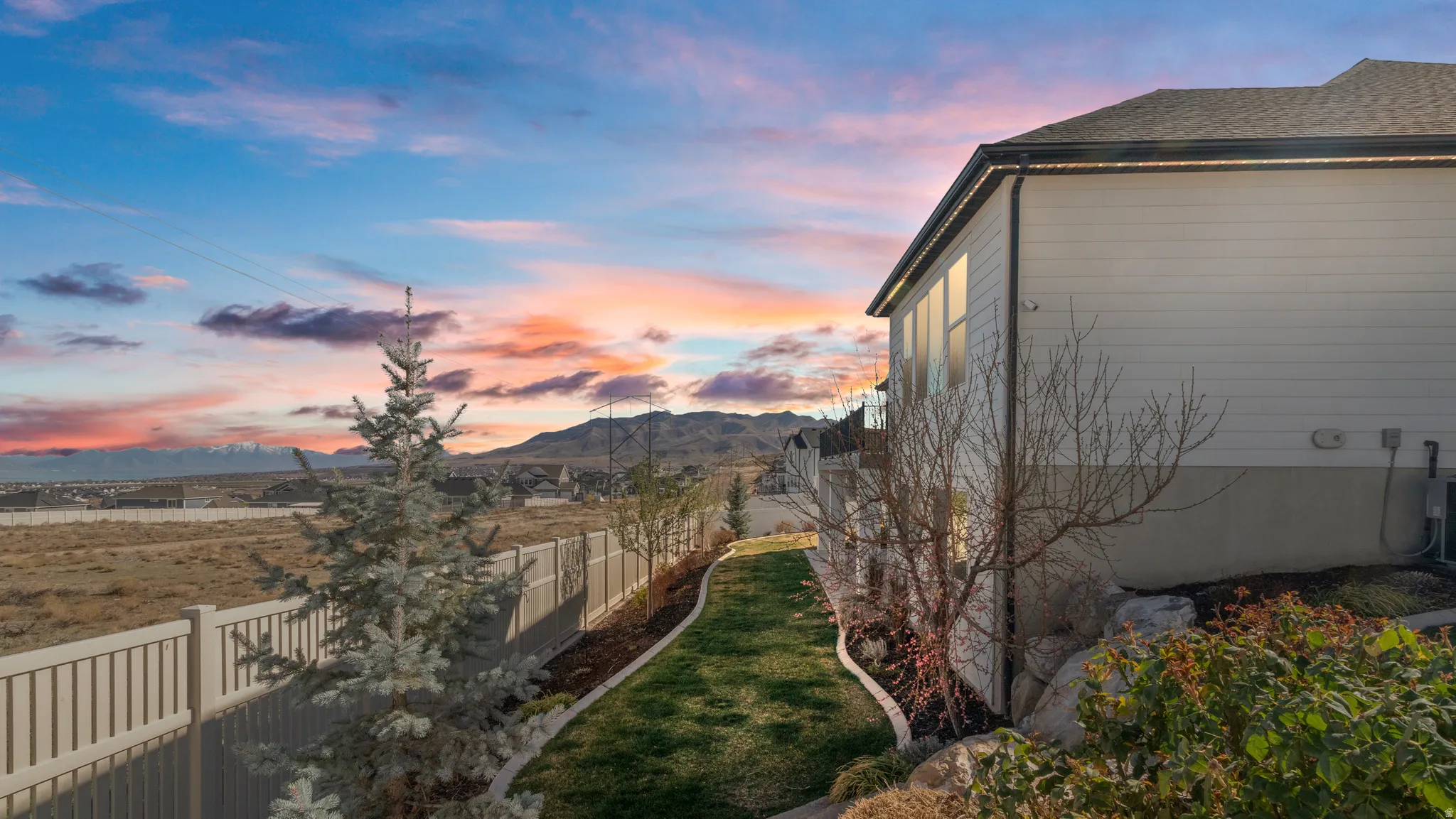 View of property exterior featuring a mountain view