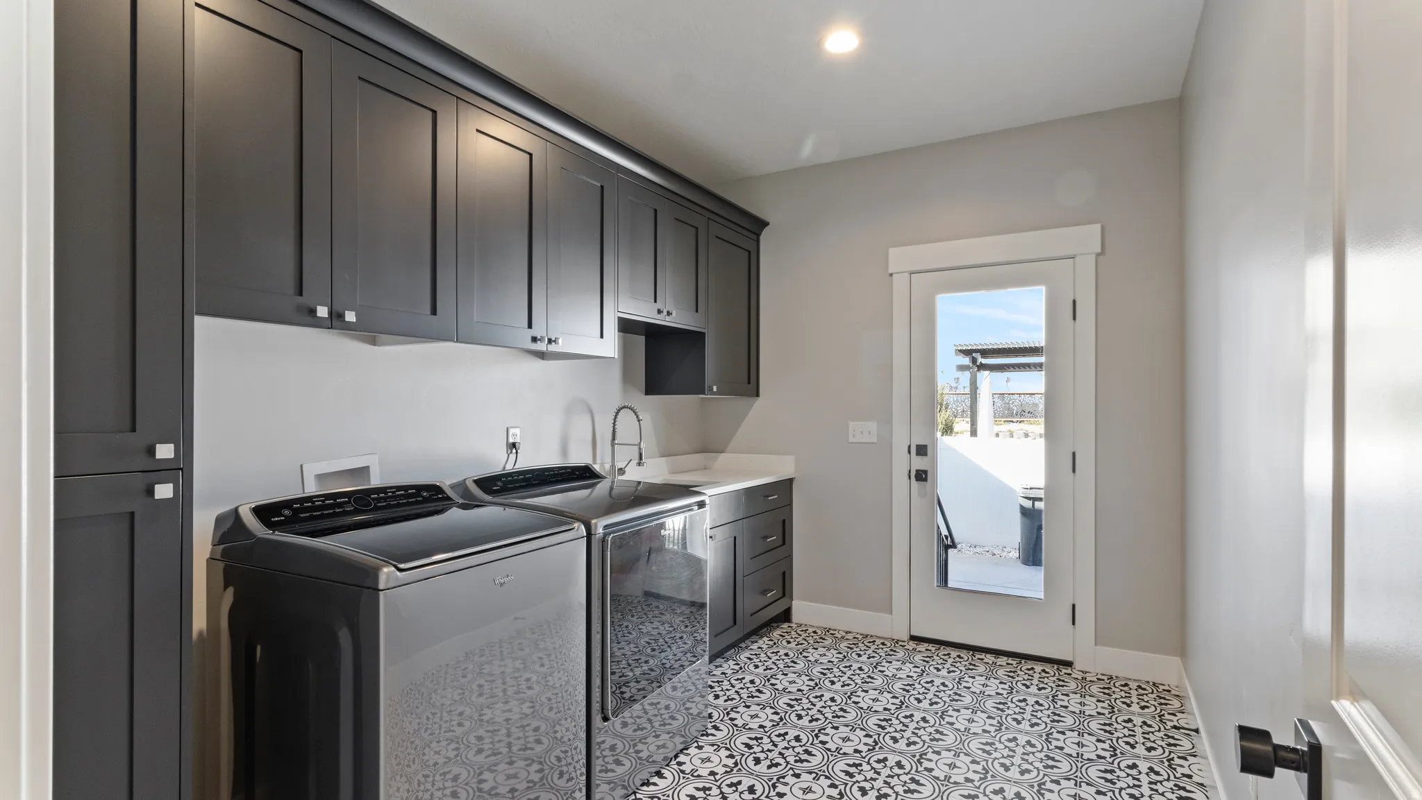 Laundry room with cabinet space and washing machine and clothes dryer