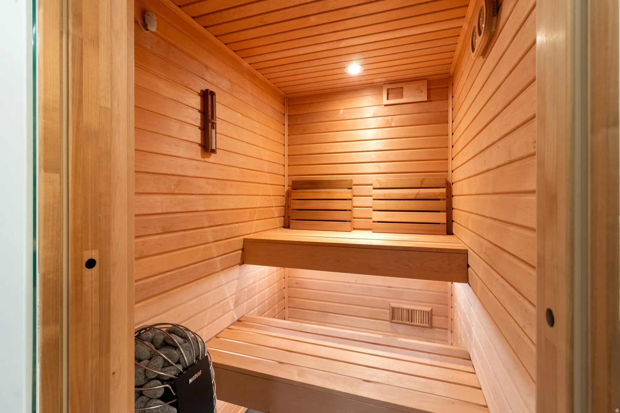 Sauna / steam room with wood walls and wood ceiling