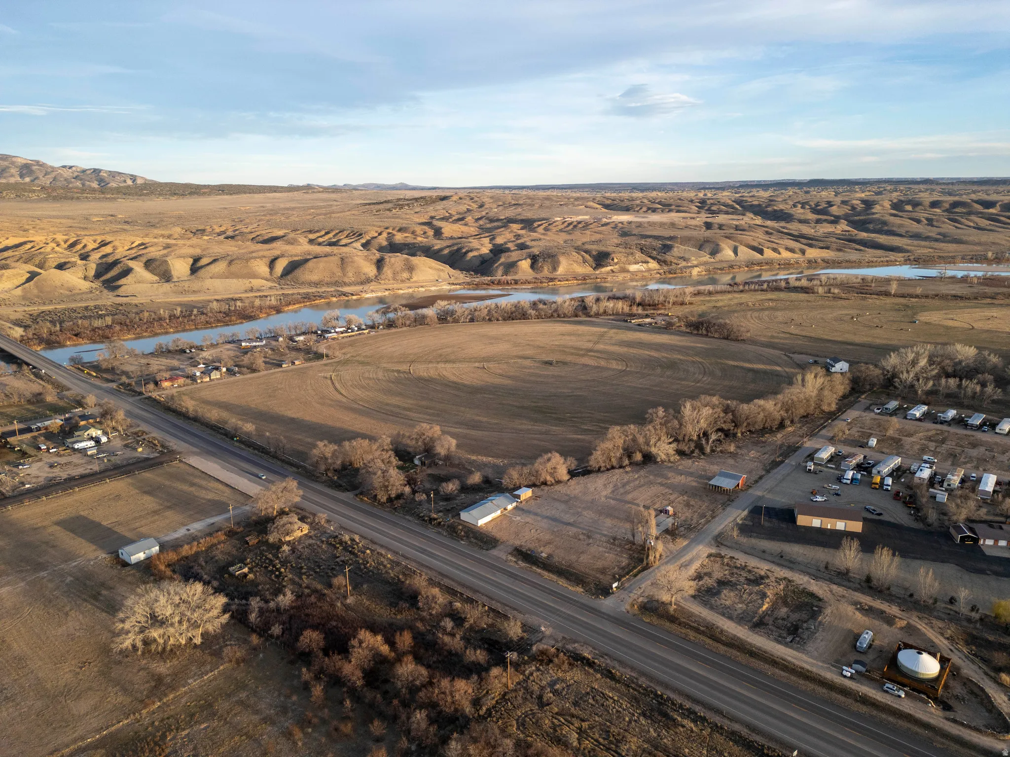 Aerial view of property's location with rural landscape and a water and mountain view