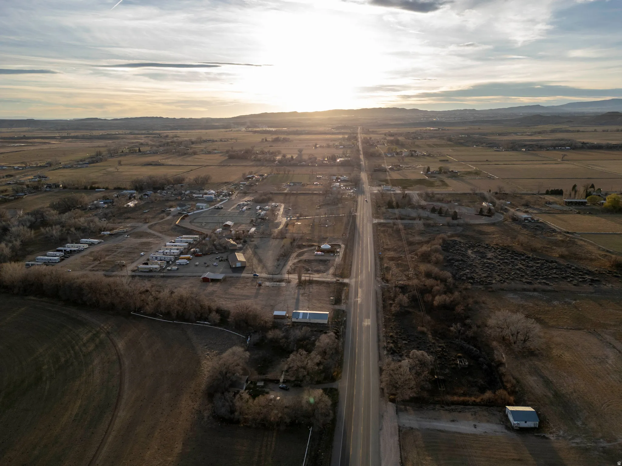 Aerial view at dusk of a view of rural / pastoral area and a mountain view