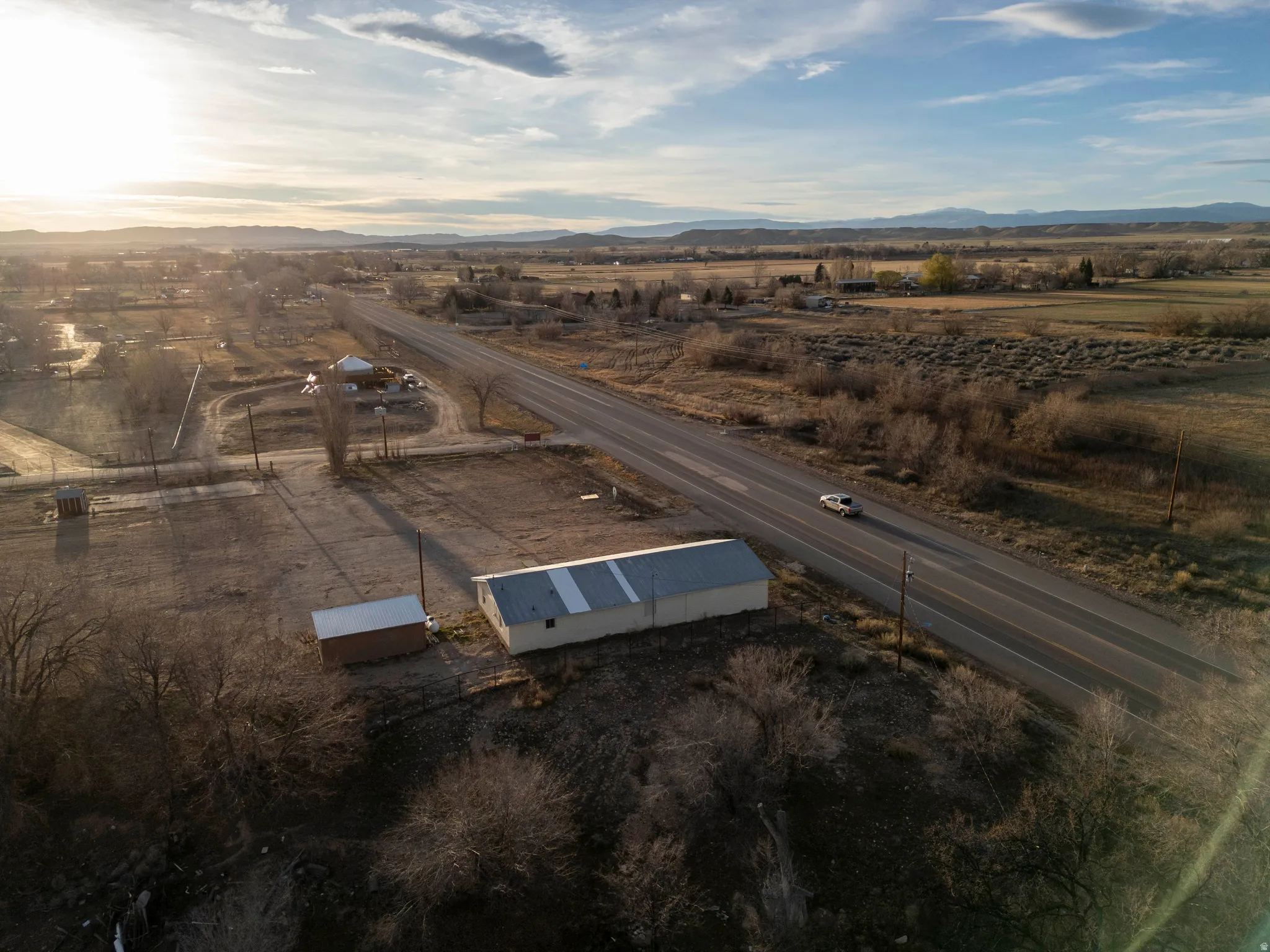 Aerial view of sparsely populated area featuring a mountainous background