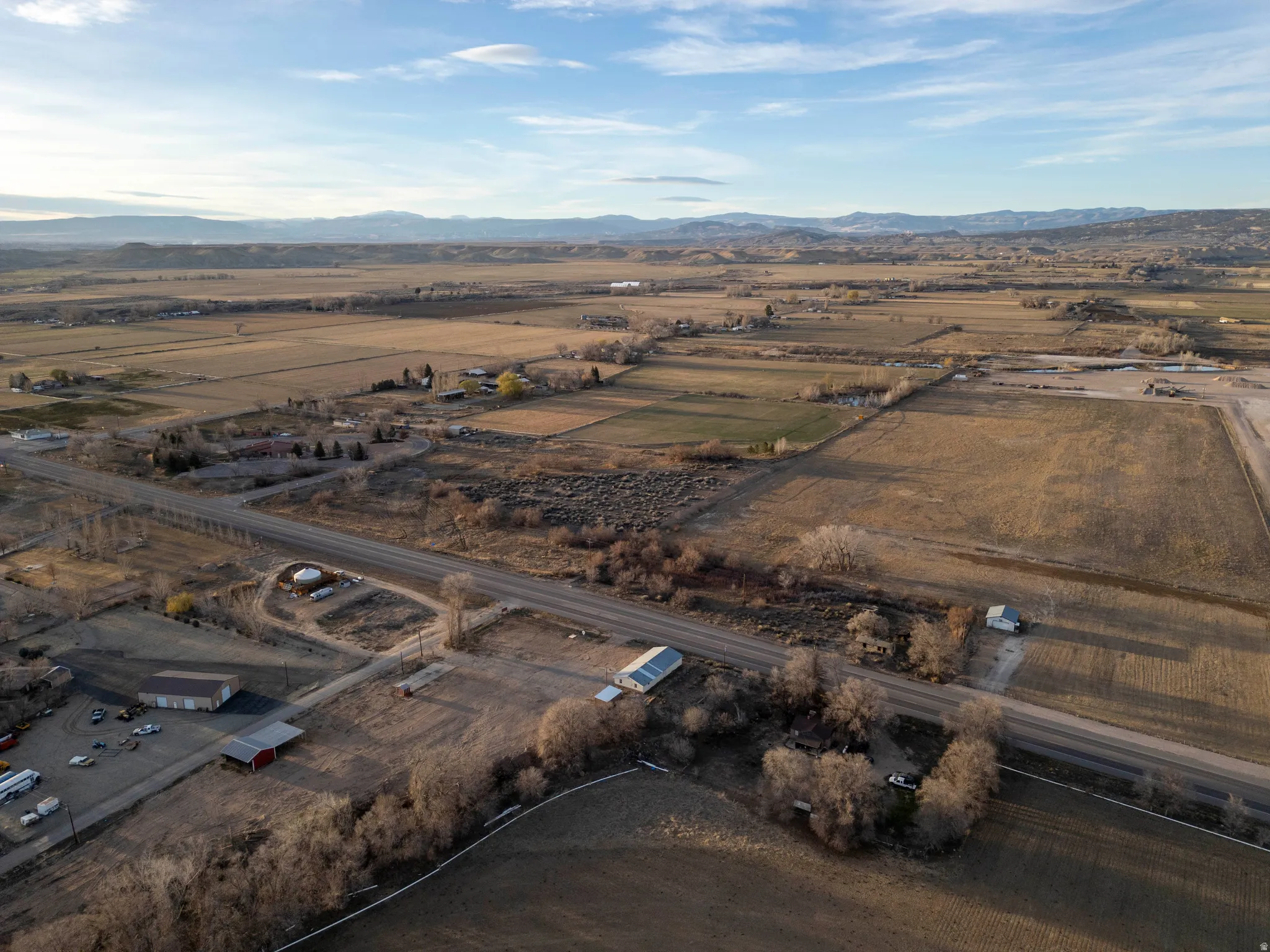 Overview of rural landscape featuring a mountainous background
