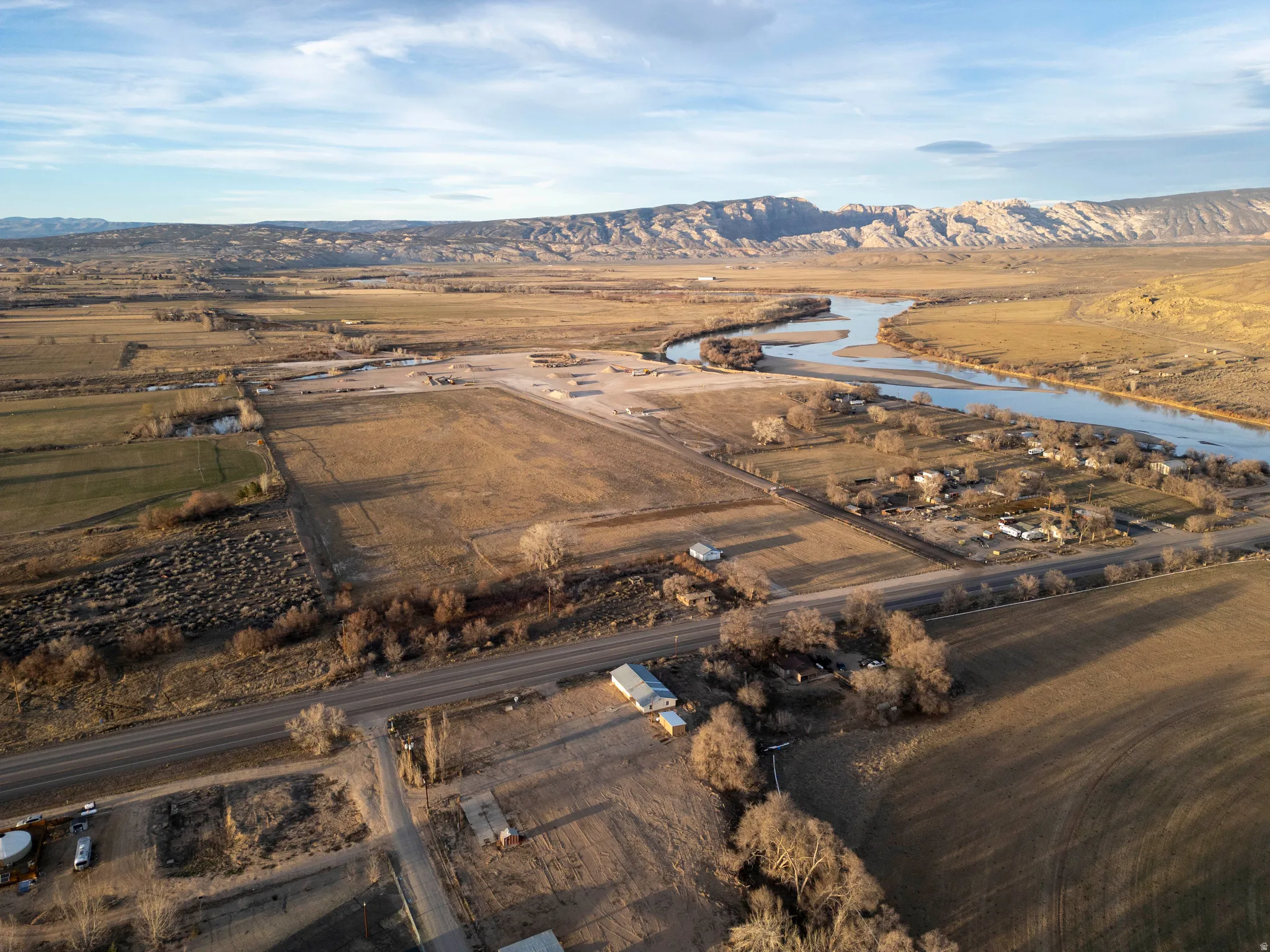 Aerial view of sparsely populated area featuring a mountainous background
