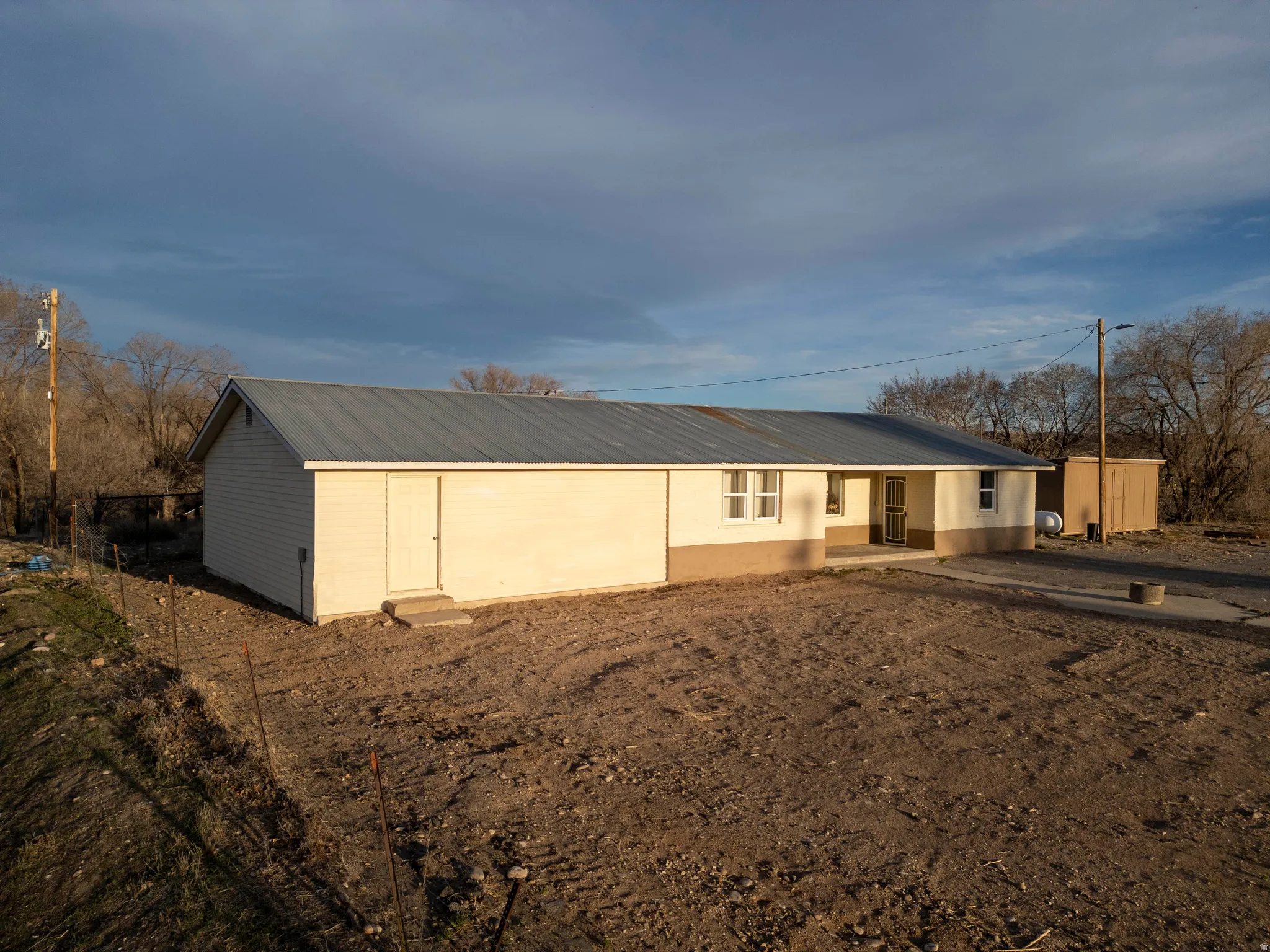 Ranch-style house featuring a metal roof