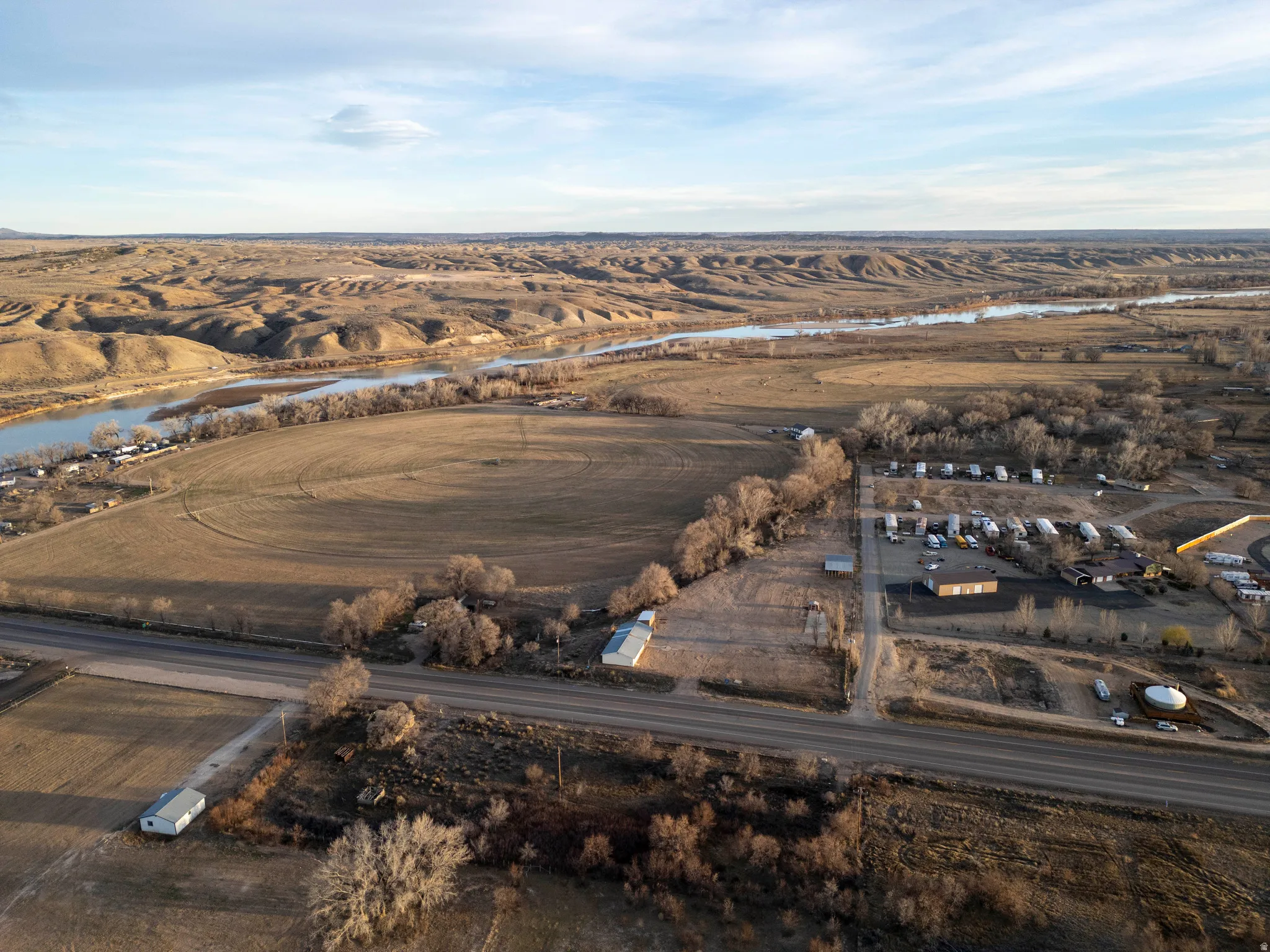 Aerial view of property and surrounding area with a large body of water