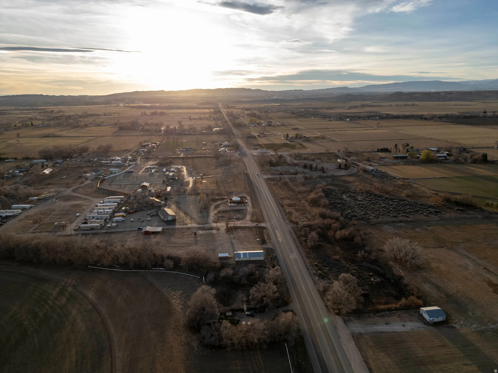 Overview of rural landscape featuring a mountainous background