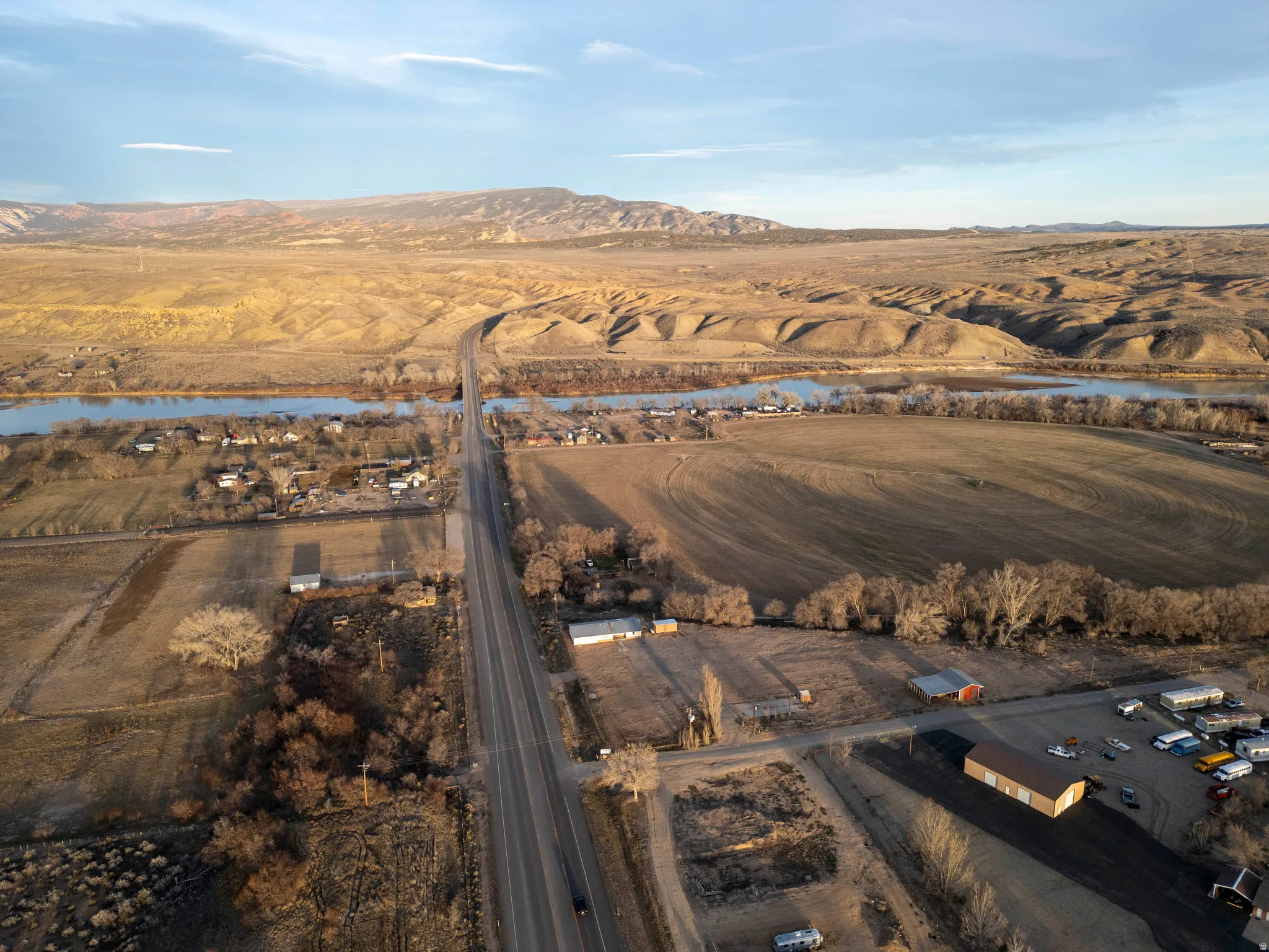 Overview of rural landscape featuring a water and mountain view