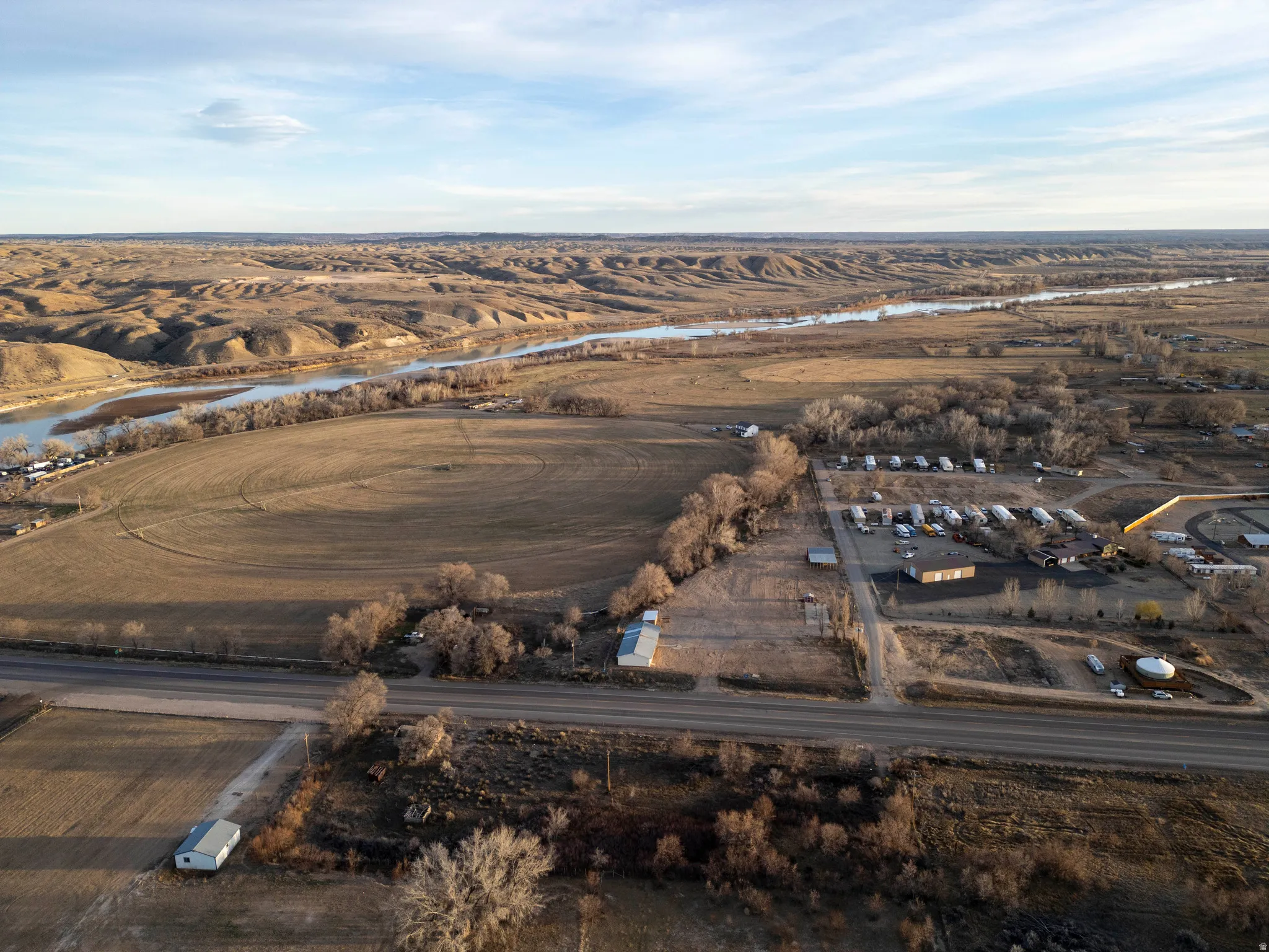 Aerial view of property and surrounding area with a large body of water