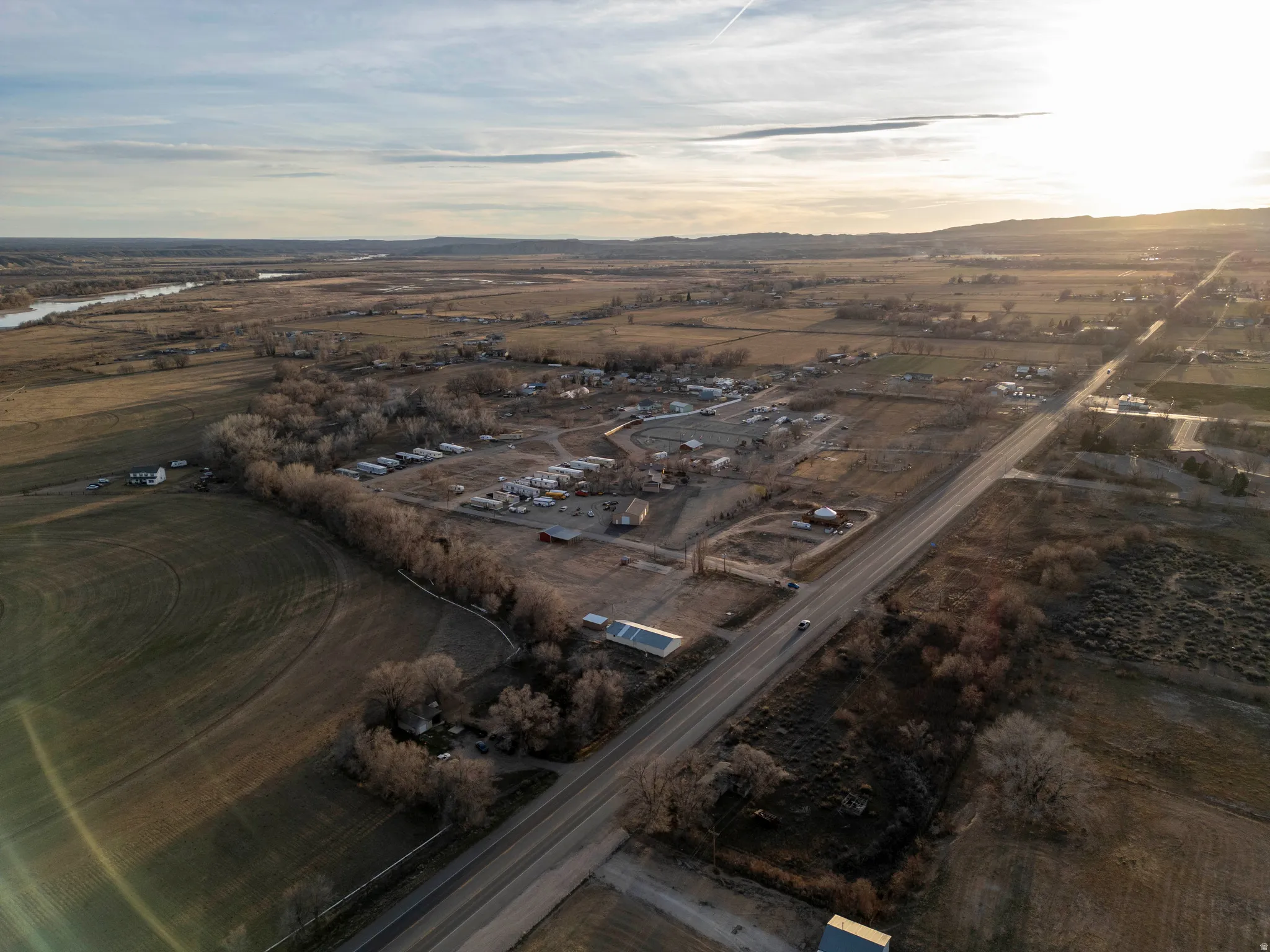 Aerial view of sparsely populated area featuring a mountainous background