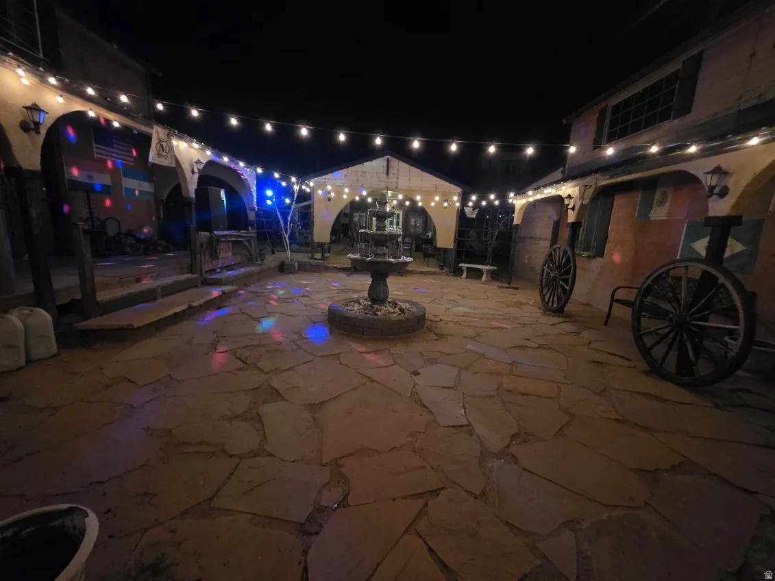 Patio at twilight featuring a patio