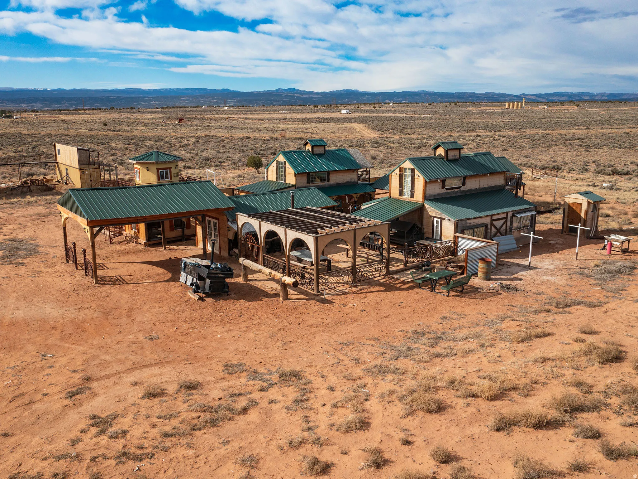 Overview of rural landscape with a desert landscape and a mountain backdrop