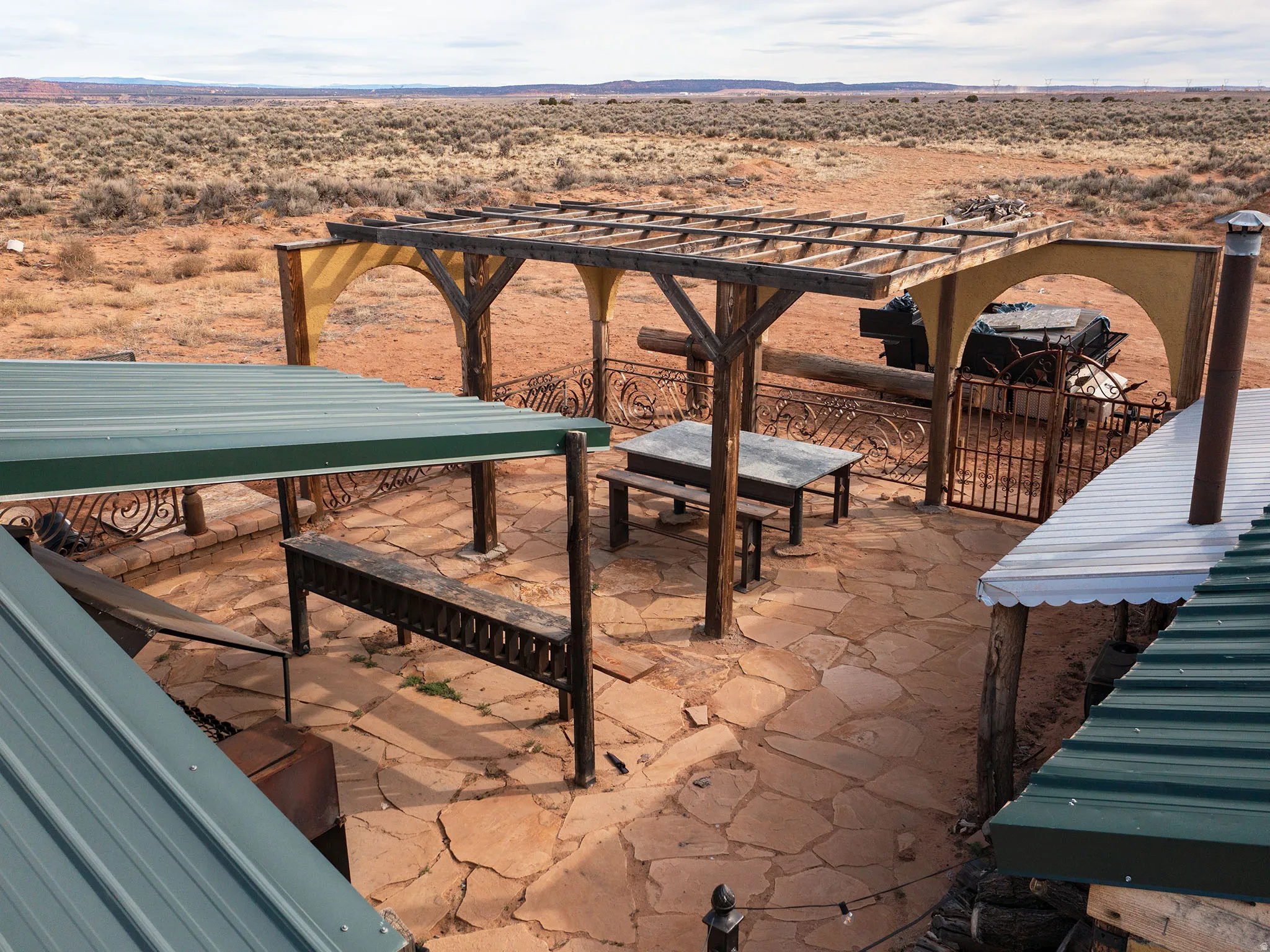 View of patio featuring a desert view, a pergola, a view of rural / pastoral area, and a mountain view