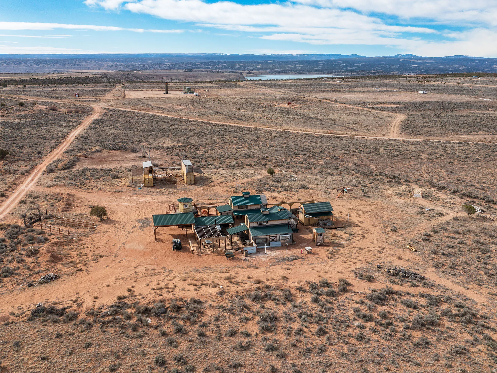 Aerial view of sparsely populated area featuring a desert landscape and a mountain backdrop