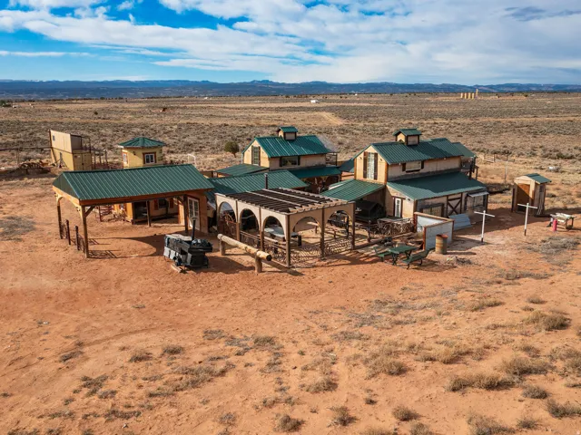 Overview of rural landscape with a desert landscape and a mountain backdrop