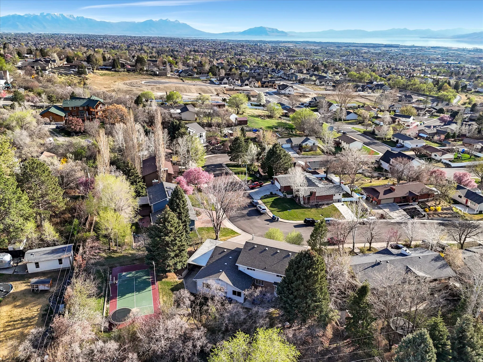 Aerial perspective of suburban area with a mountainous background