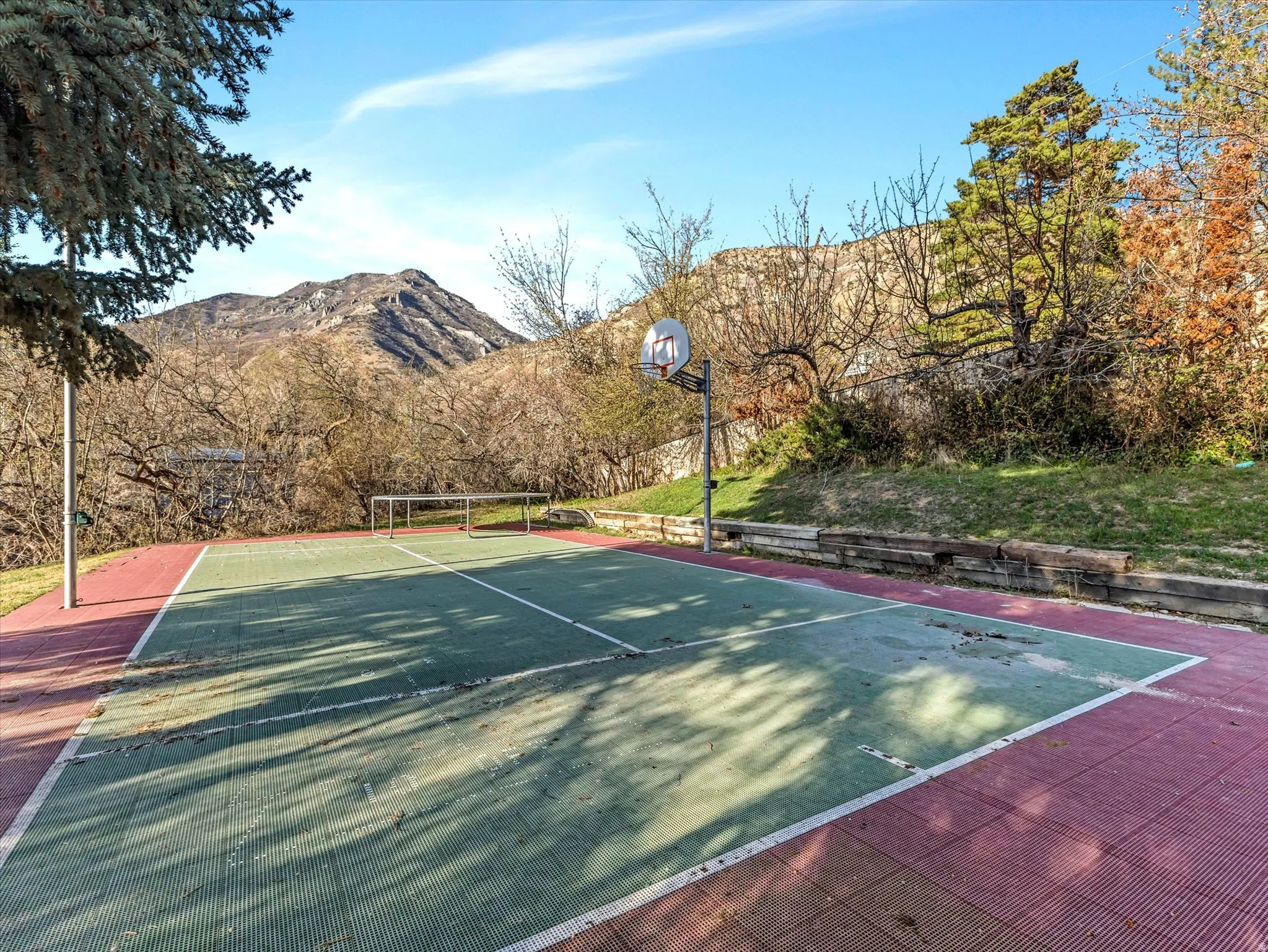 View of sport court with a mountain view and community basketball court