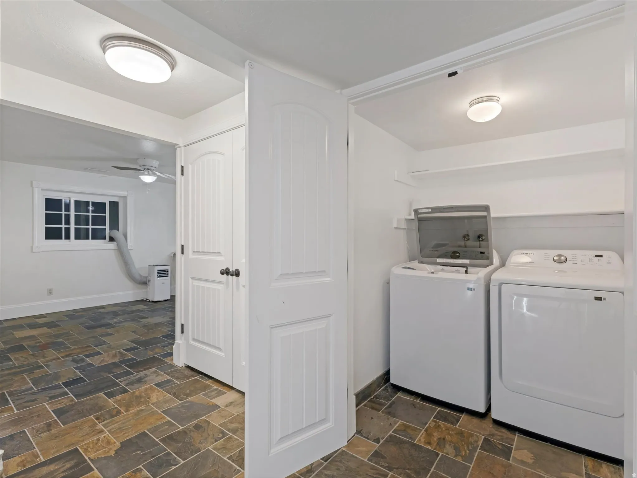Apartment laundry and entrance to kitchen/dining area.