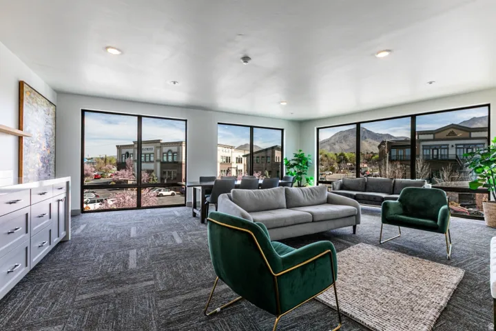 Living room featuring a mountain view, dark carpet, and recessed lighting