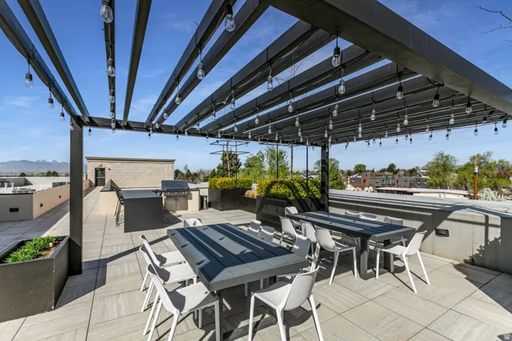 View of patio / terrace featuring an outdoor kitchen / dining area and a mountain view