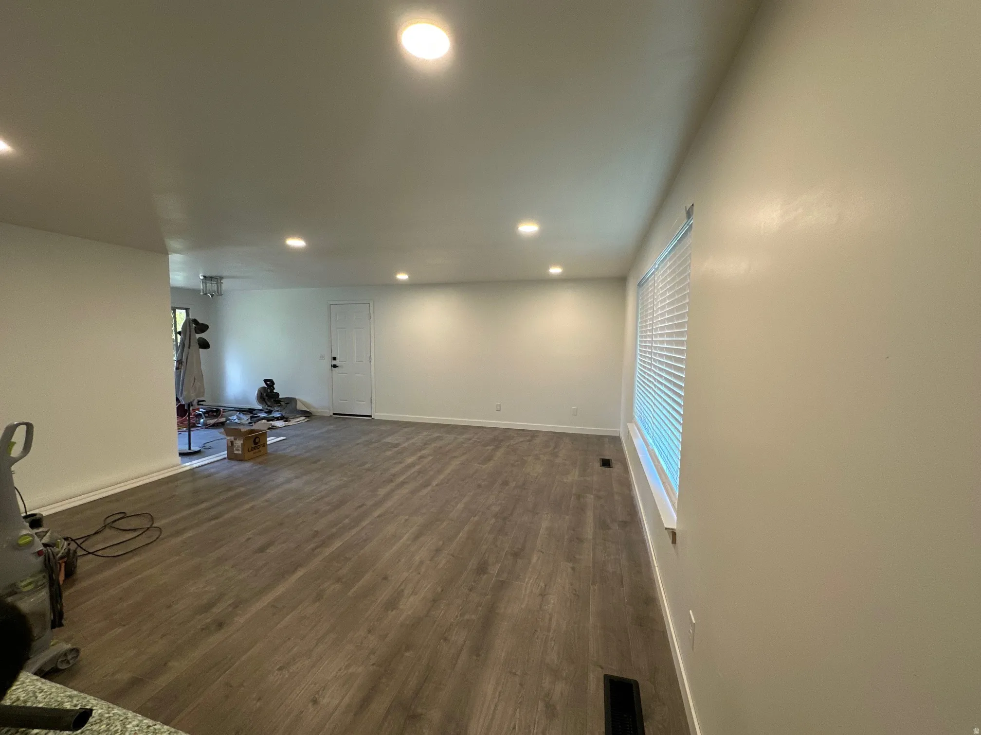 Workout area featuring recessed lighting and dark wood-type flooring