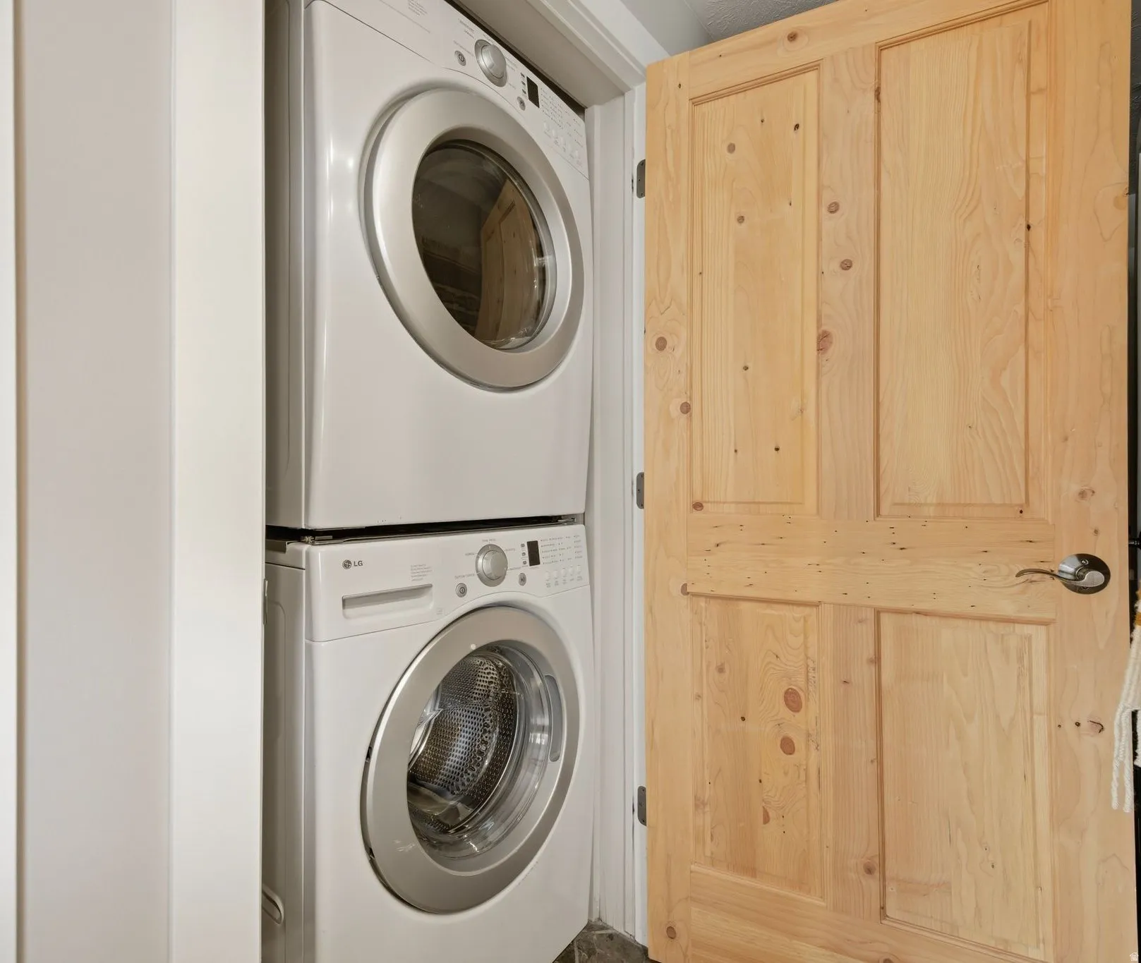 Laundry area with stacked washer / drying machine
