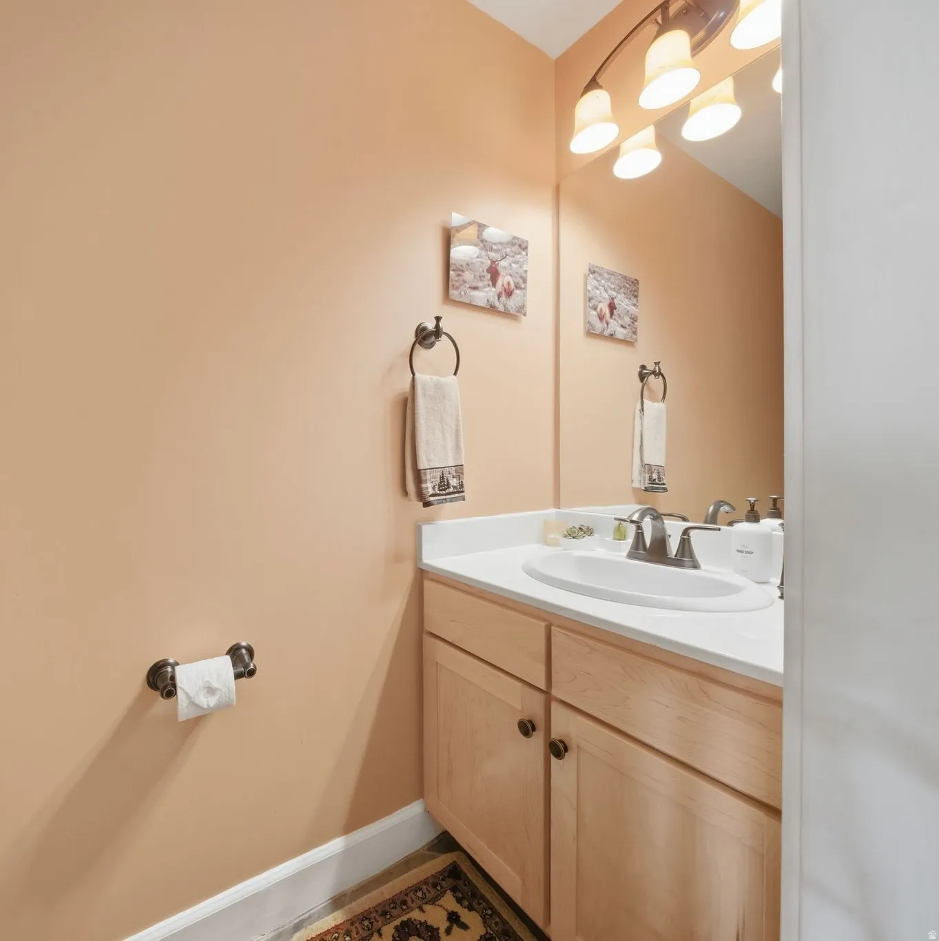 Bathroom with vanity and baseboards