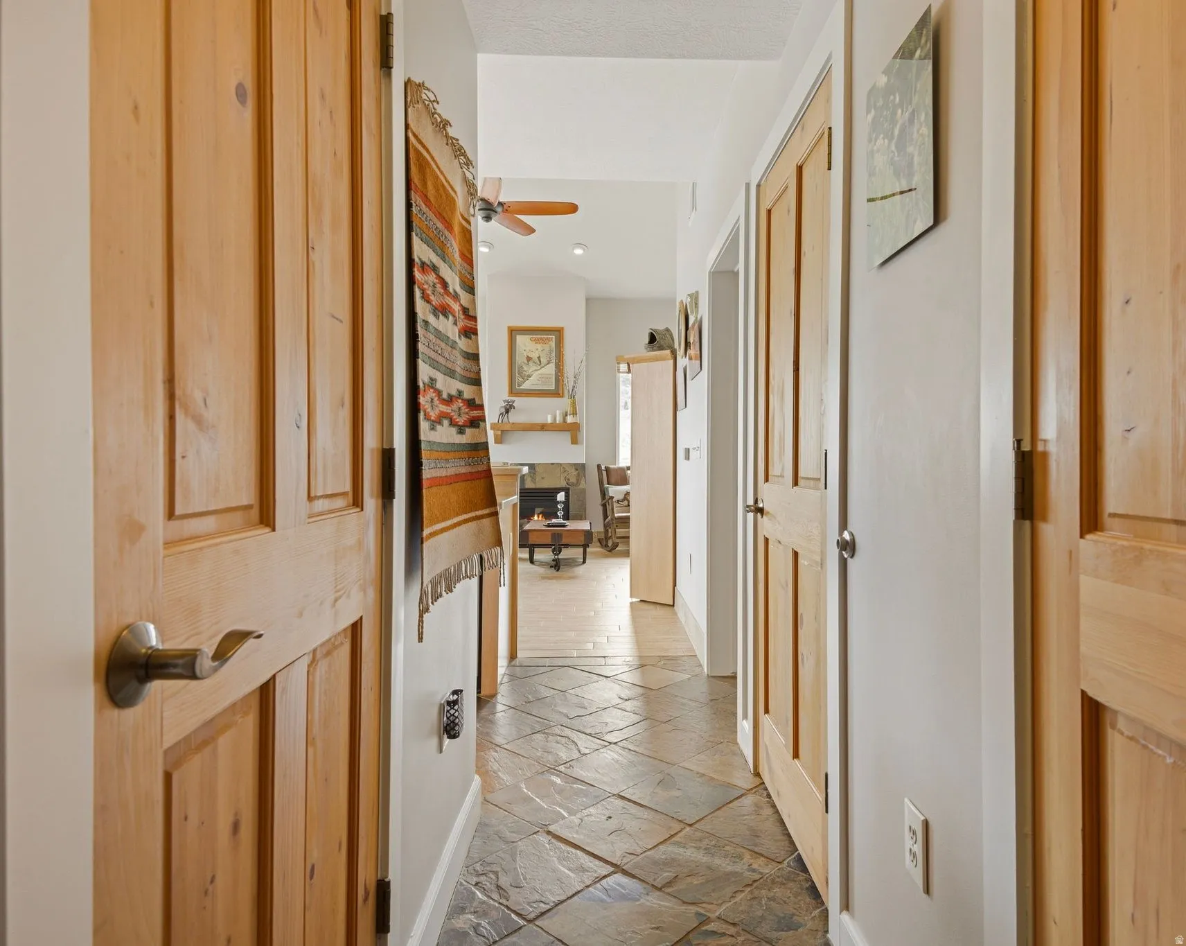Hallway with light stone finish floors