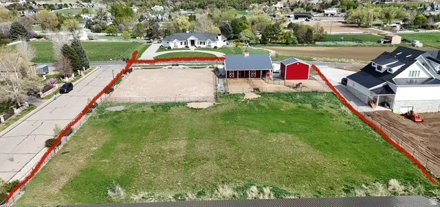 Aerial view of residential area with property parcel outlined